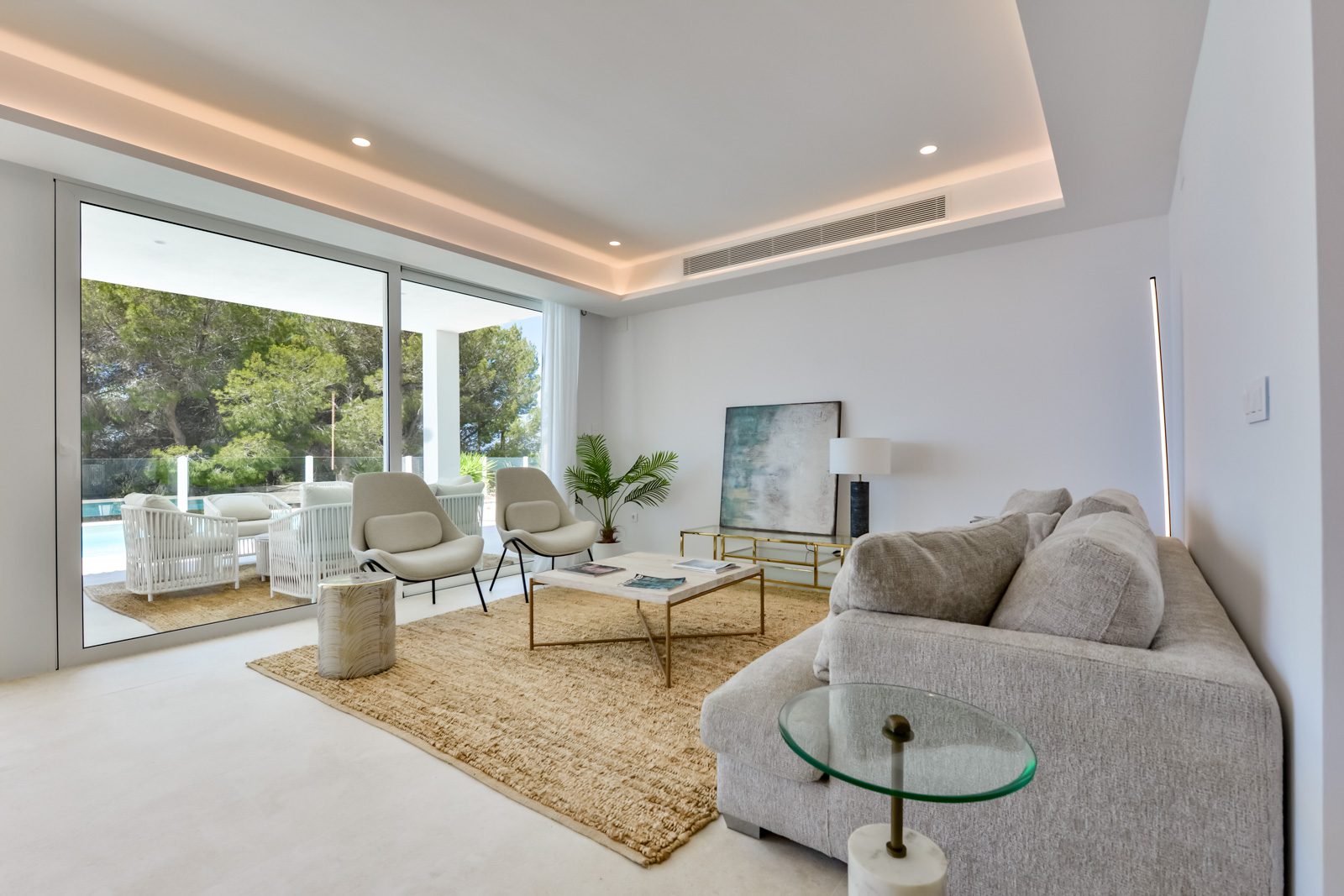 Stylish living room with modern furnishings and sea views in a 3-bedroom villa in Altea - The Estates