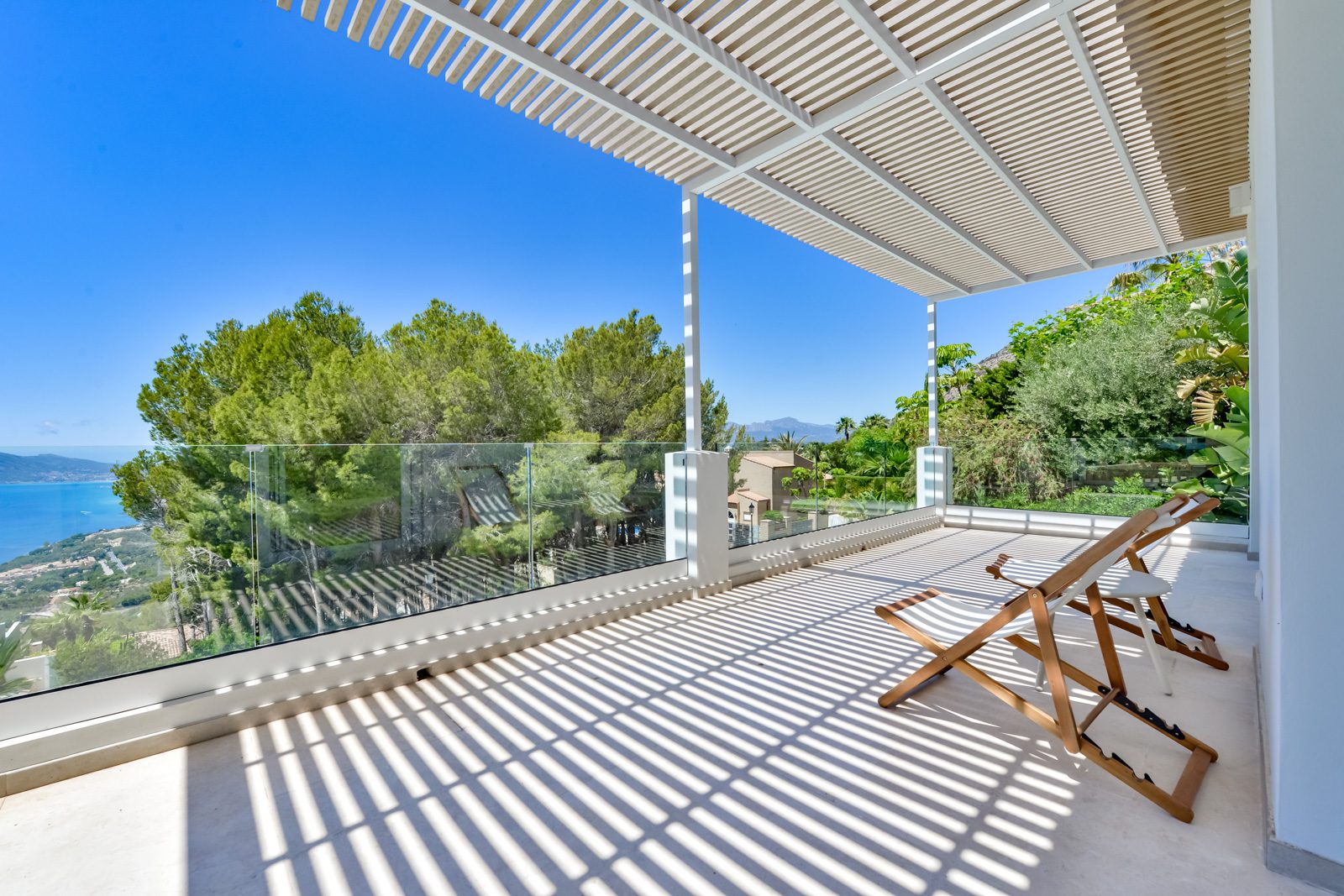 A covered terrace with sea views at a 3-bedroom villa in Altea - The Estates
