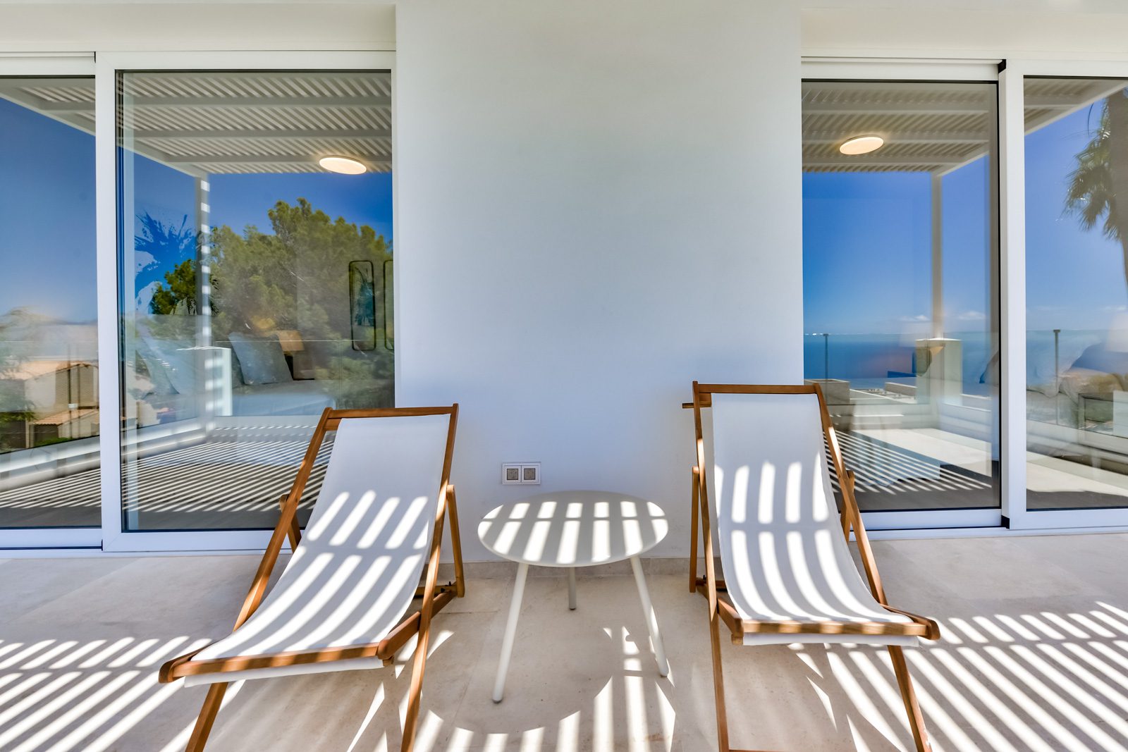 Relaxing lounge chairs and sea views from a 3-bedroom villa in Altea - The Estates