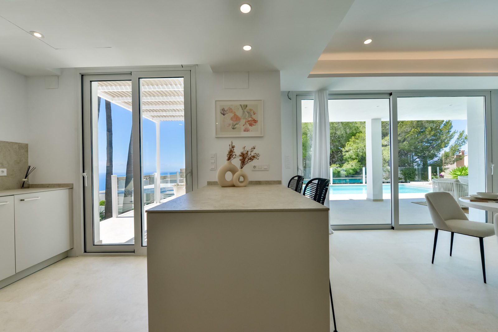 Modern kitchen island with sea views from a 3-bedroom villa in Altea - The Estates