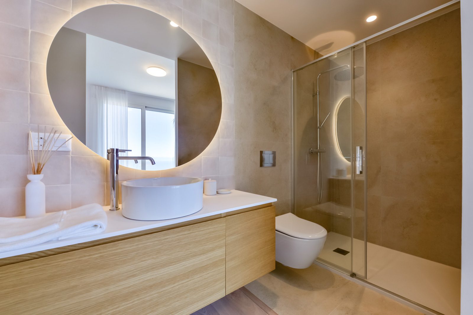 A modern bathroom with a walk-in shower in a 3-bedroom villa in Altea - The Estates