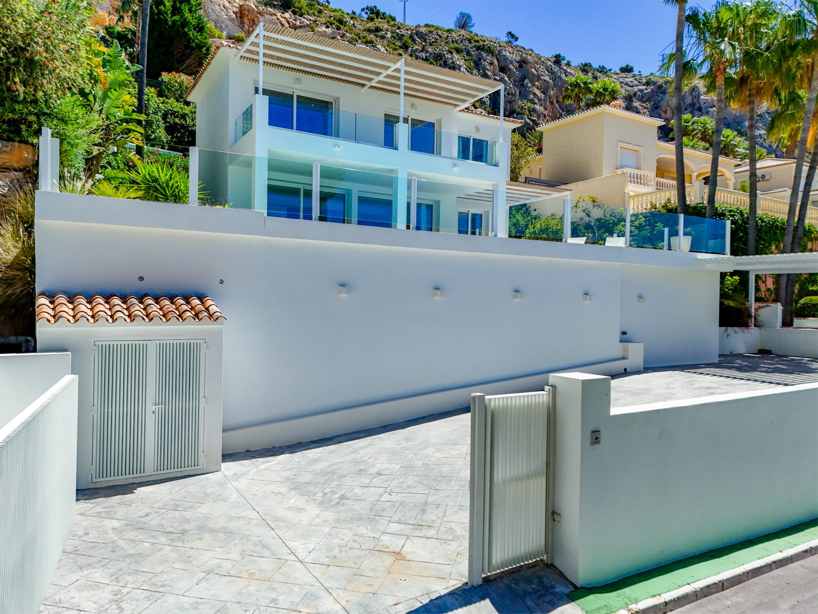 Exterior view of a modern 3-bedroom villa nestled in Altea Hills, with sea views - The Estates