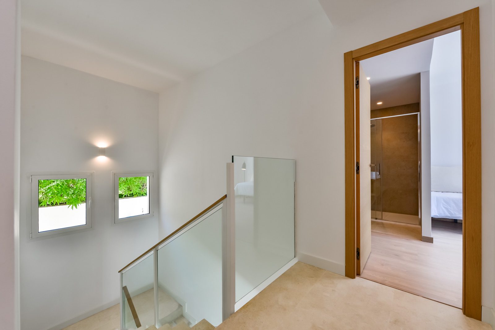 Interior hallway with staircase and window view of a 3-bedroom villa in Altea - The Estates