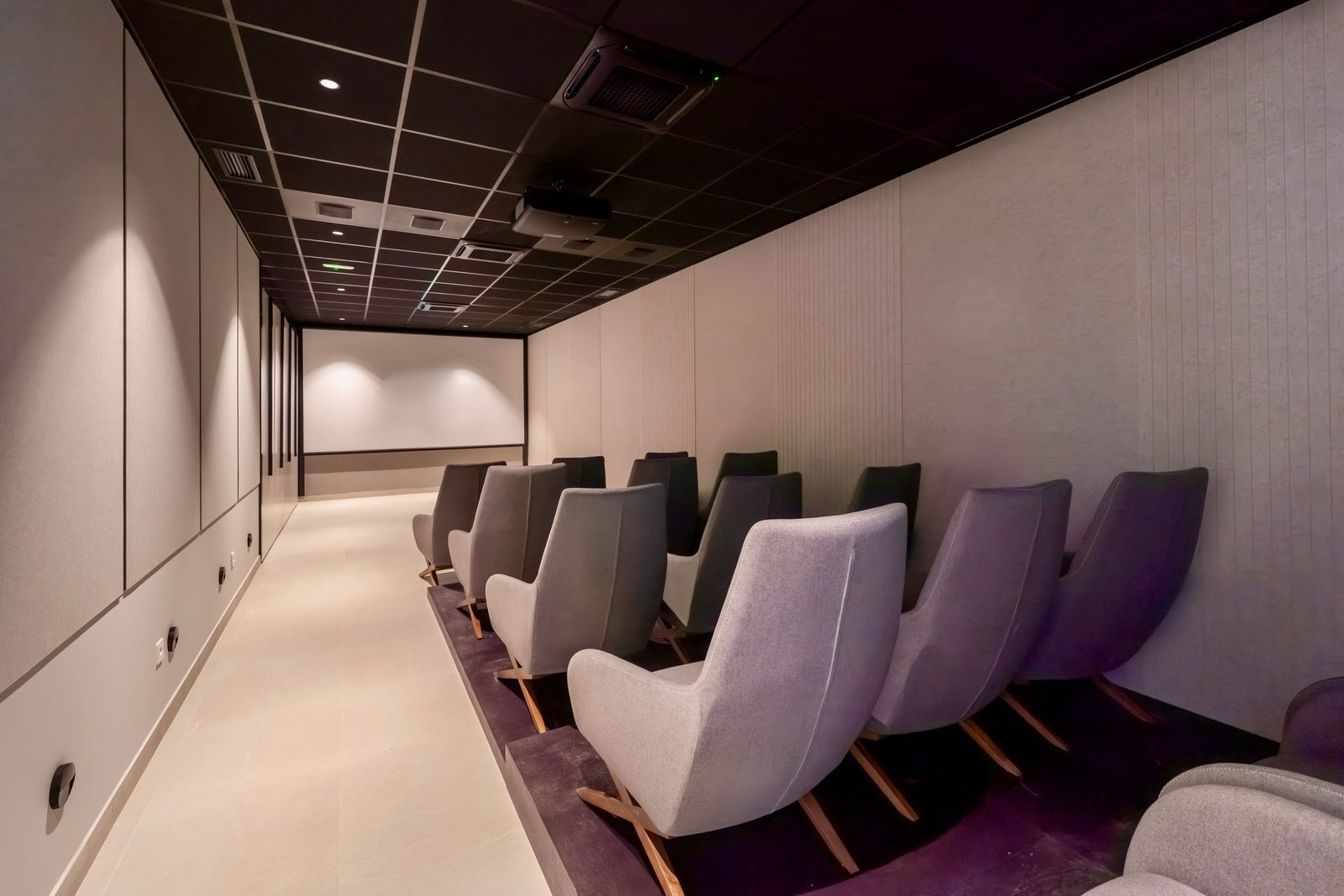 A modern home cinema room with comfortable seating in a 3-bedroom apartment in Alfaz del Pi - The Estates