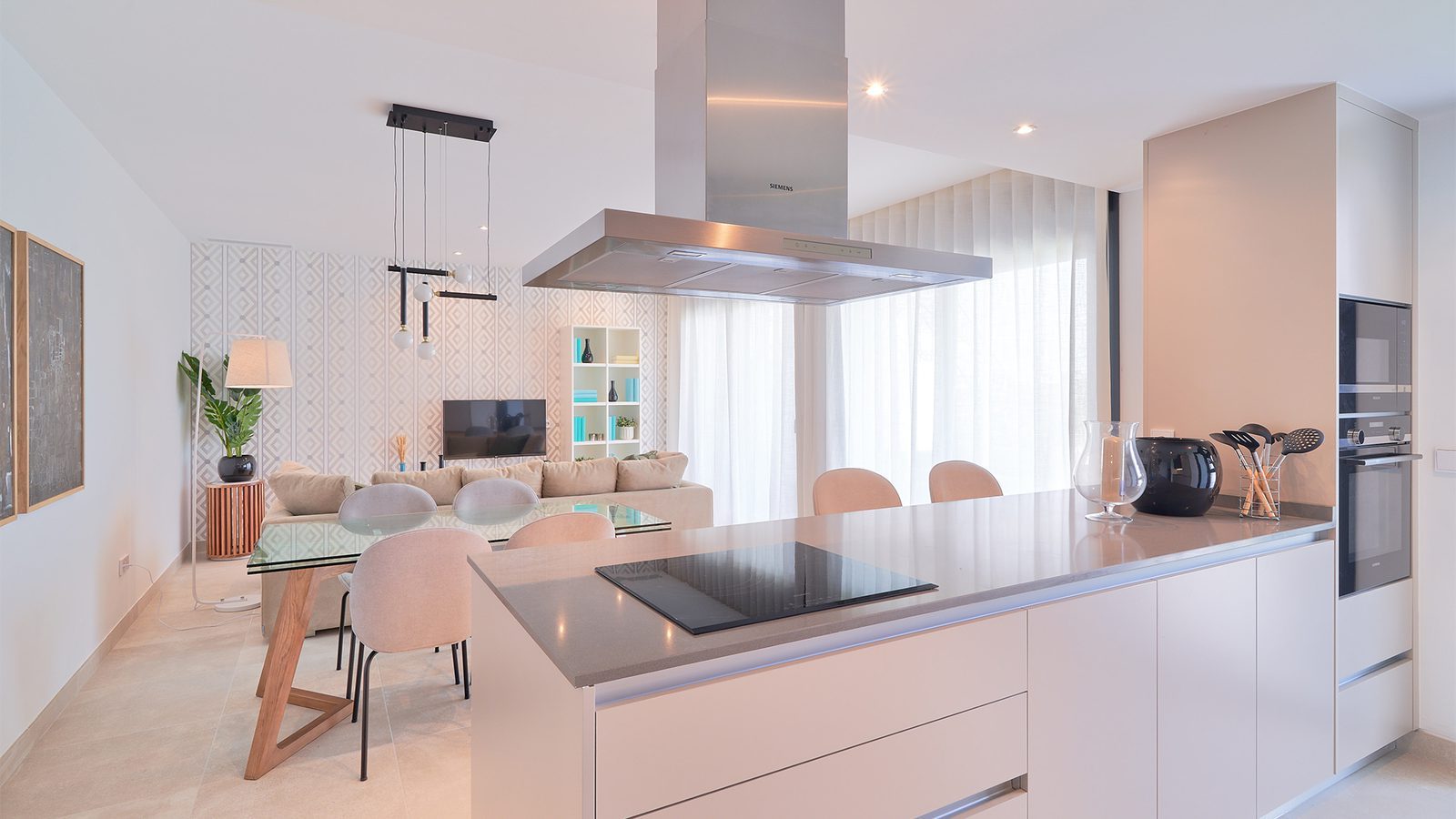 Modern open-plan kitchen and living area of a 3-bedroom apartment in Estepona - The Estates