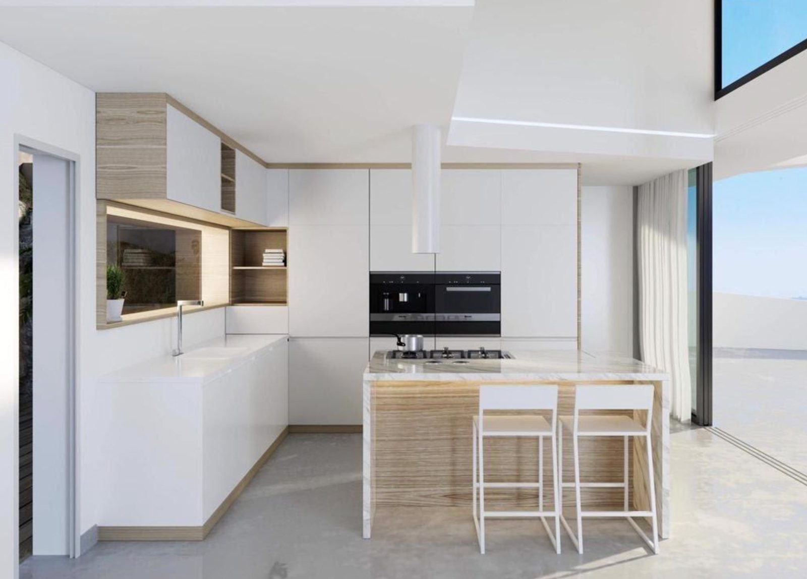 Modern open-plan kitchen with island, integrated appliances and sea views in a 3-bedroom villa in Benitachell - The Estates