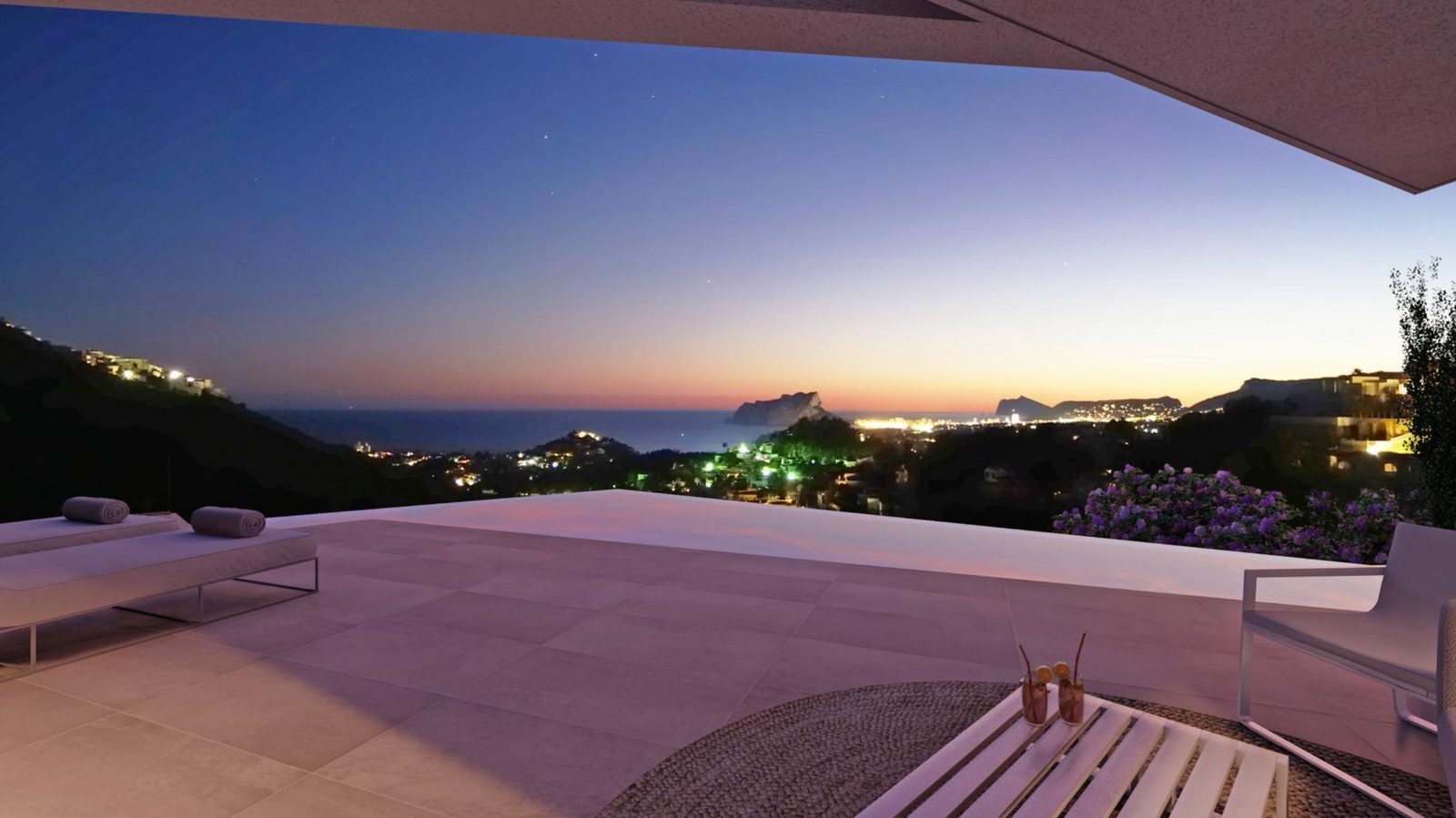 Infinity pool terrace with panoramic sea views at dusk of a 3-bedroom villa in Benitachell - The Estates