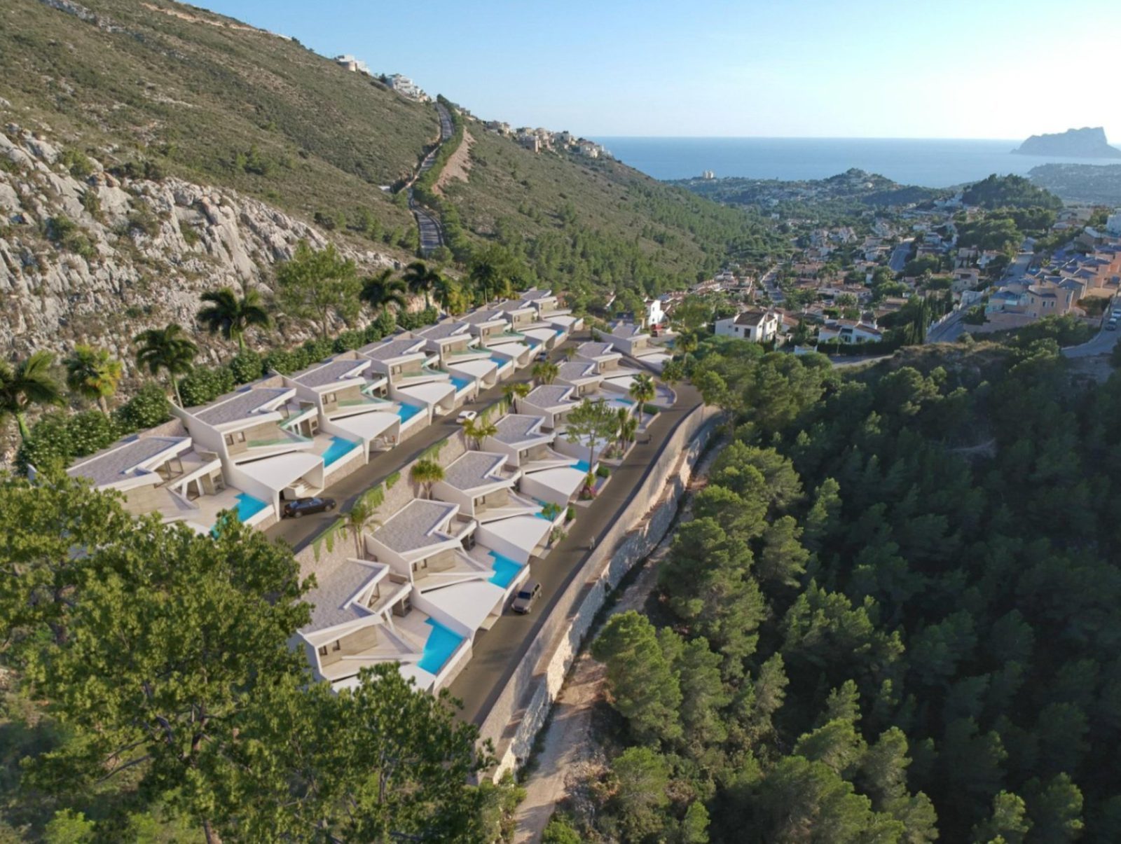 Aerial view of villas with private pools, hillside landscape and panoramic sea views in Benitachell - The Estates