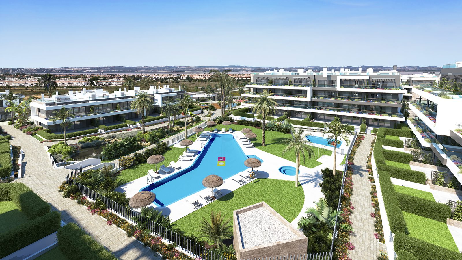 Aerial view of a modern residential complex with a pool and gardens, a 3-bedroom semi-detached in Torrevieja - The Estates