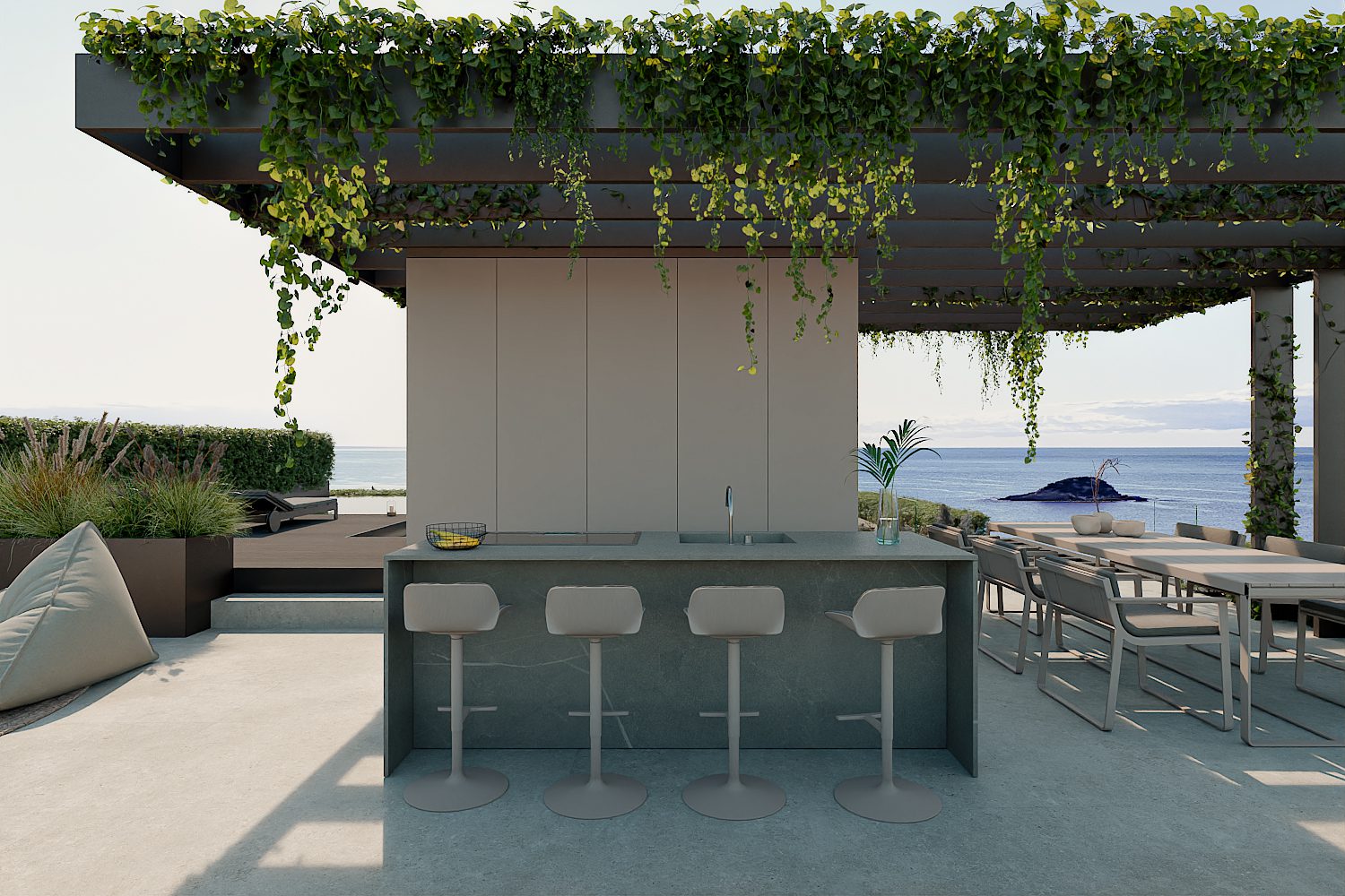 A stylish outdoor kitchen and seating area with sea views in a 3-bedroom apartment in Altea - The Estates
