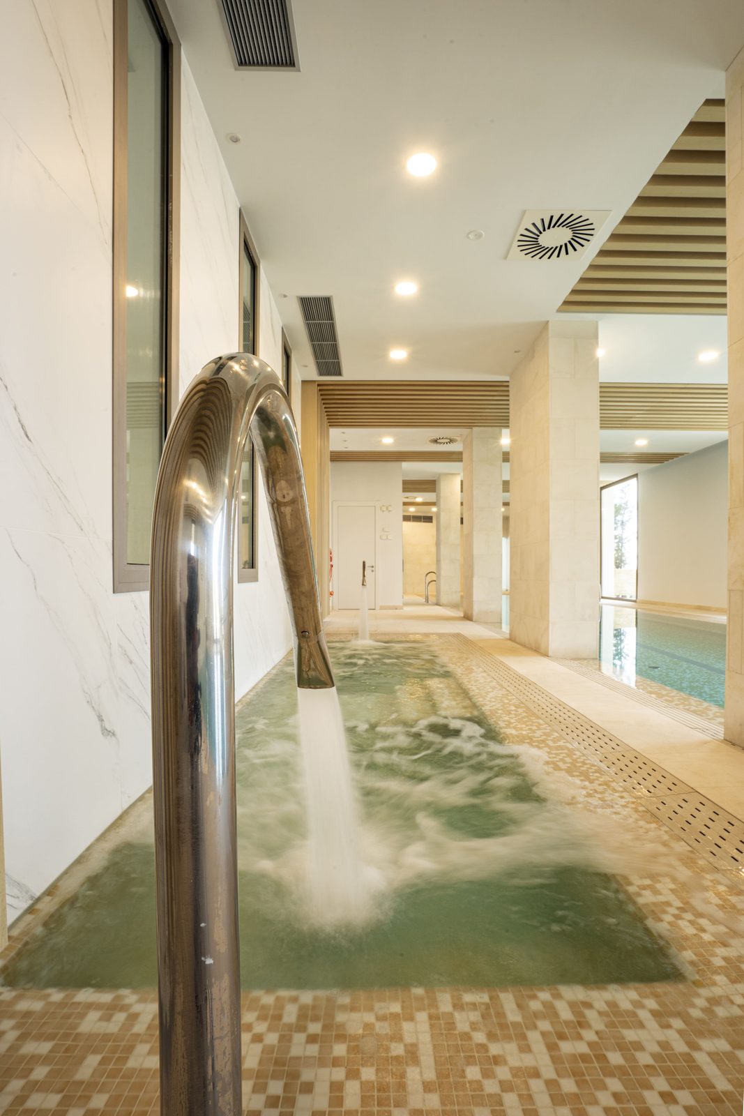 Indoor spa pool with water jets and tiled surround in a 4-bedroom penthouse in Málaga - The Estates