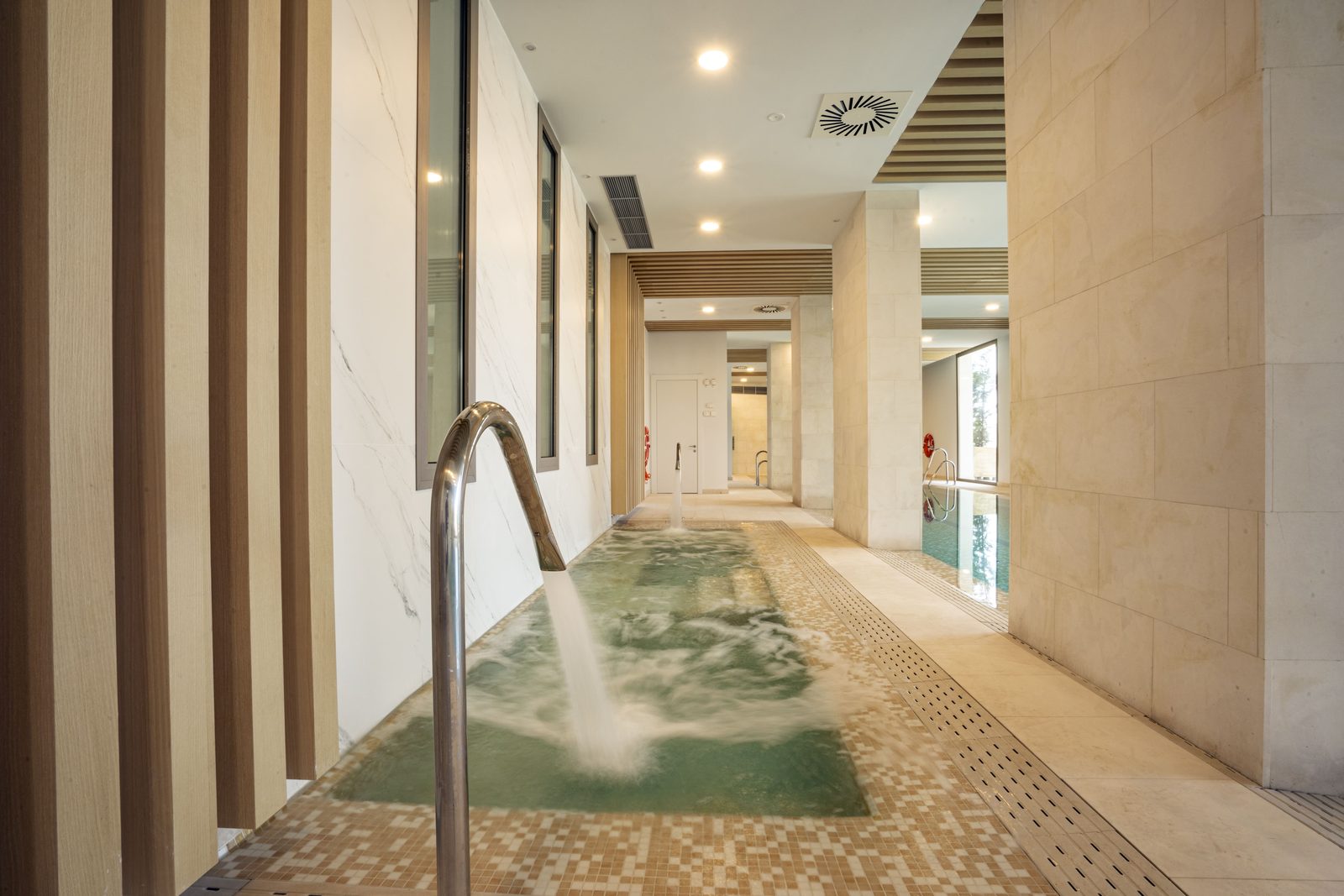 Indoor spa pool with water jets and tiled surround in a 4-bedroom penthouse in Málaga - The Estates