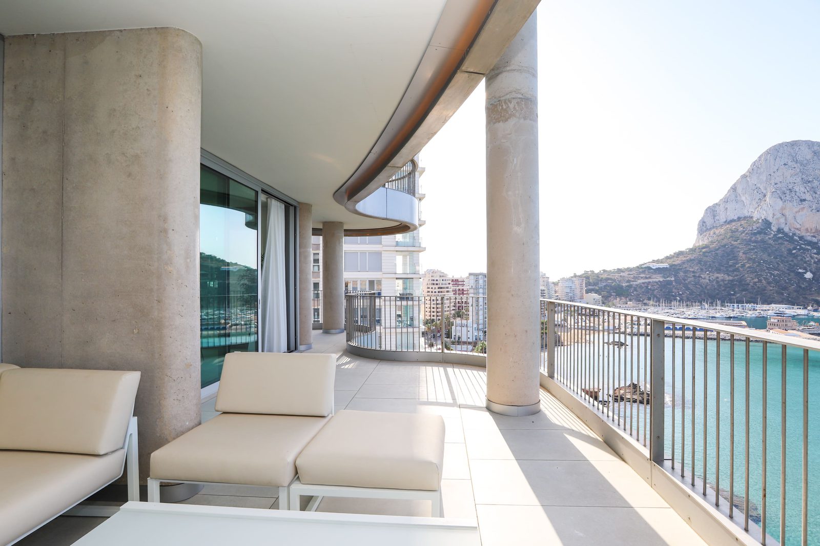 A balcony with sea and marina views from a 4-bedroom apartment in Calpe - The Estates