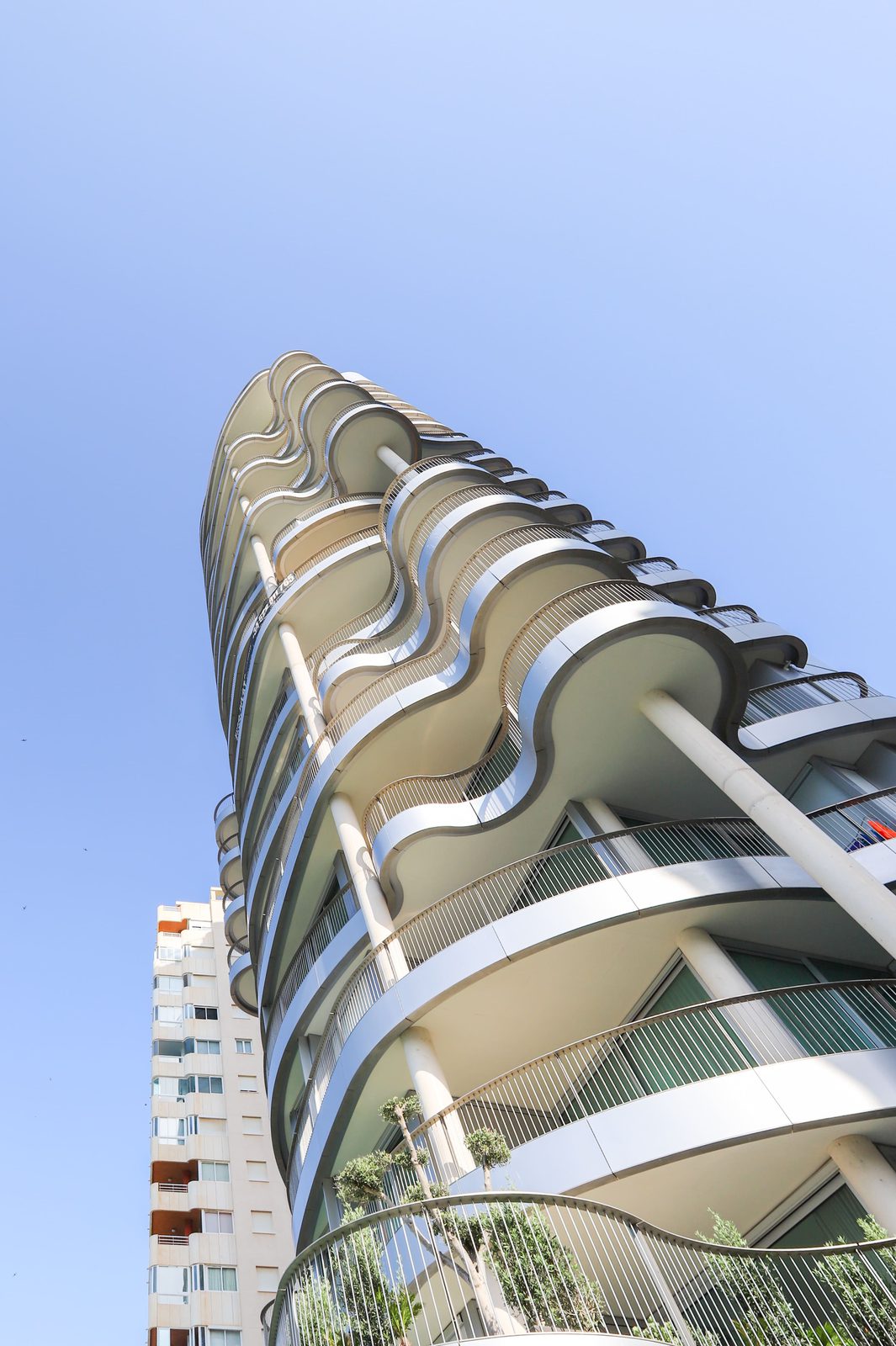 Modern apartment building with curved balconies in Calpe - The Estates
