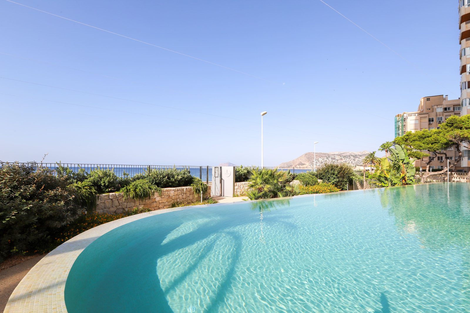 A swimming pool with sea views from a 4-bedroom apartment in Calpe - The Estates