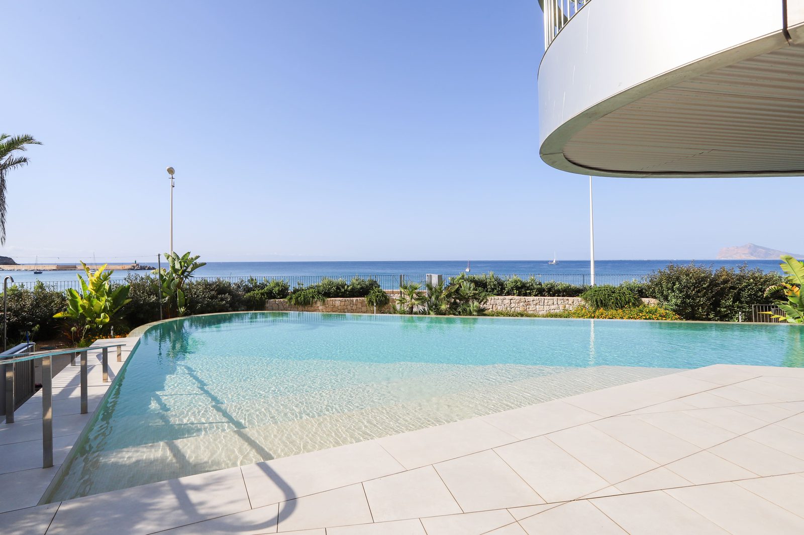 A beautiful pool area with sea views of a 4-bedroom apartment in Calpe - The Estates