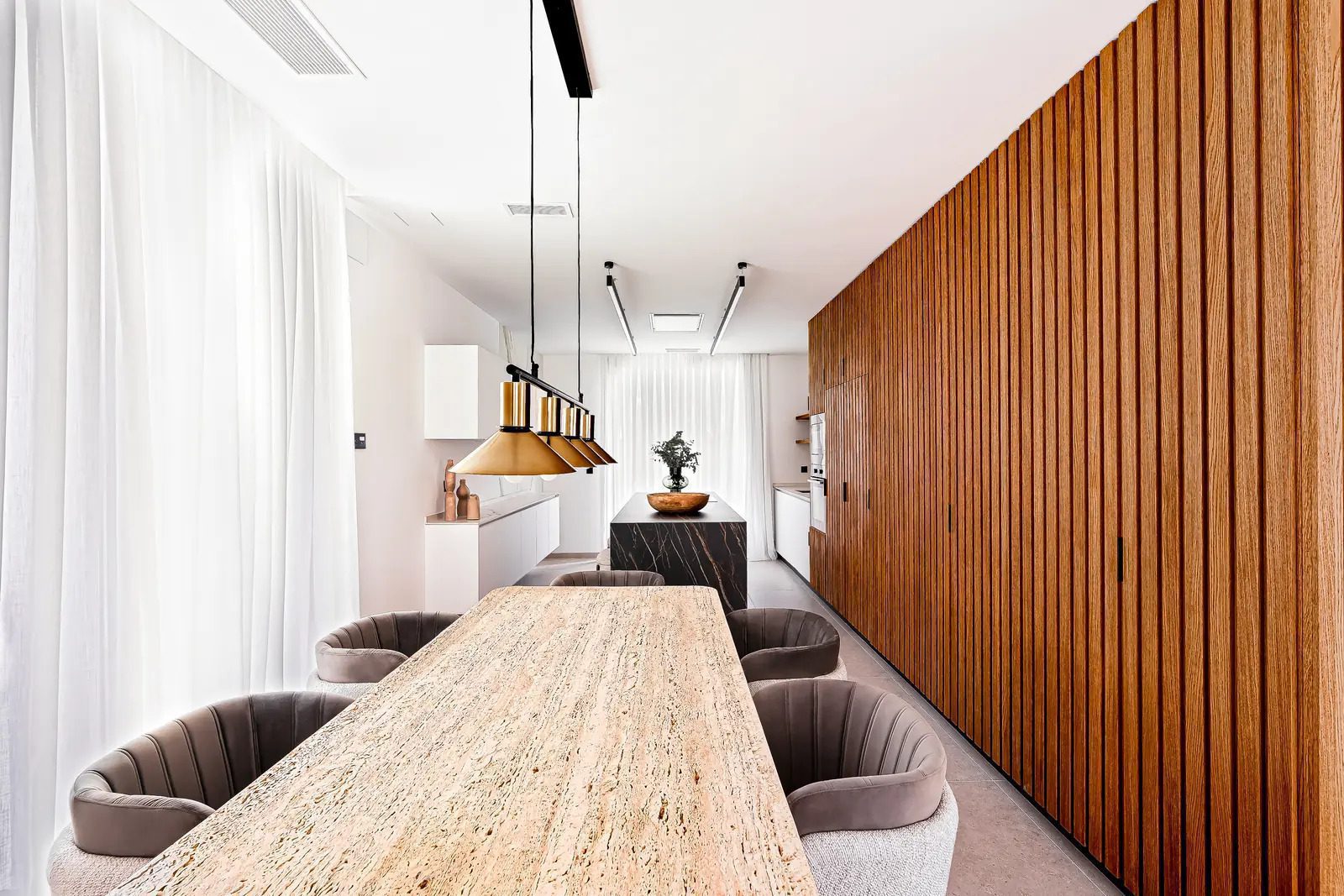 Stylish dining area with wood paneling of a 4-bedroom villa in La Nucia - The Estates