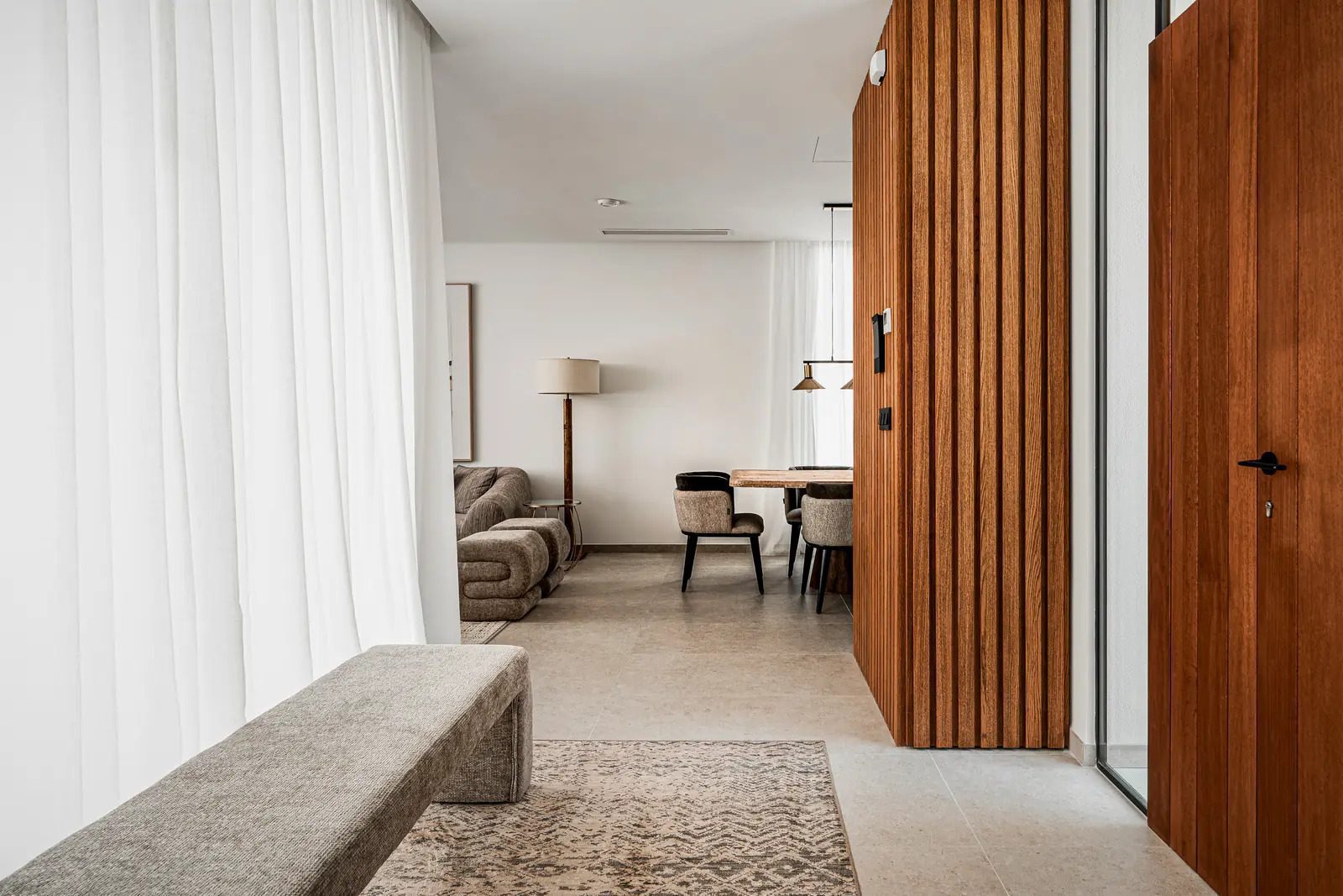 Stylish interior design with wood paneling and a seating area in a 4-bedroom villa in La Nucia - The Estates