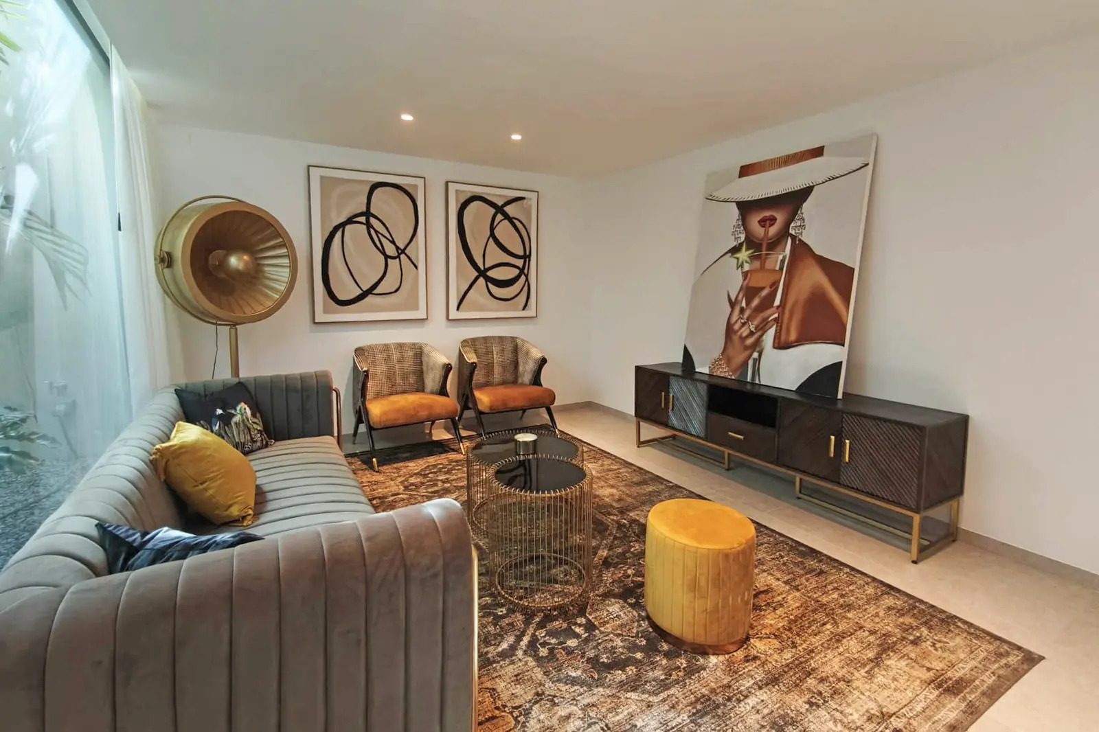 Stylish living room interior with modern furniture and artwork in a 4-bedroom villa in La Nucia - The Estates
