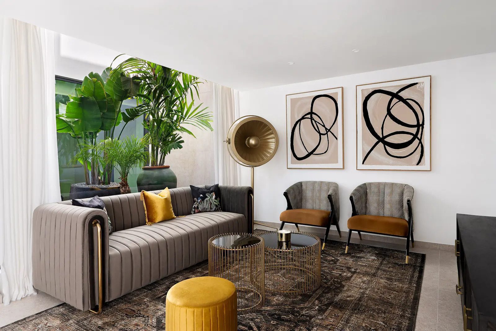 Stylish living room with modern decor and lush greenery in a 4-bedroom villa in La Nucia - The Estates