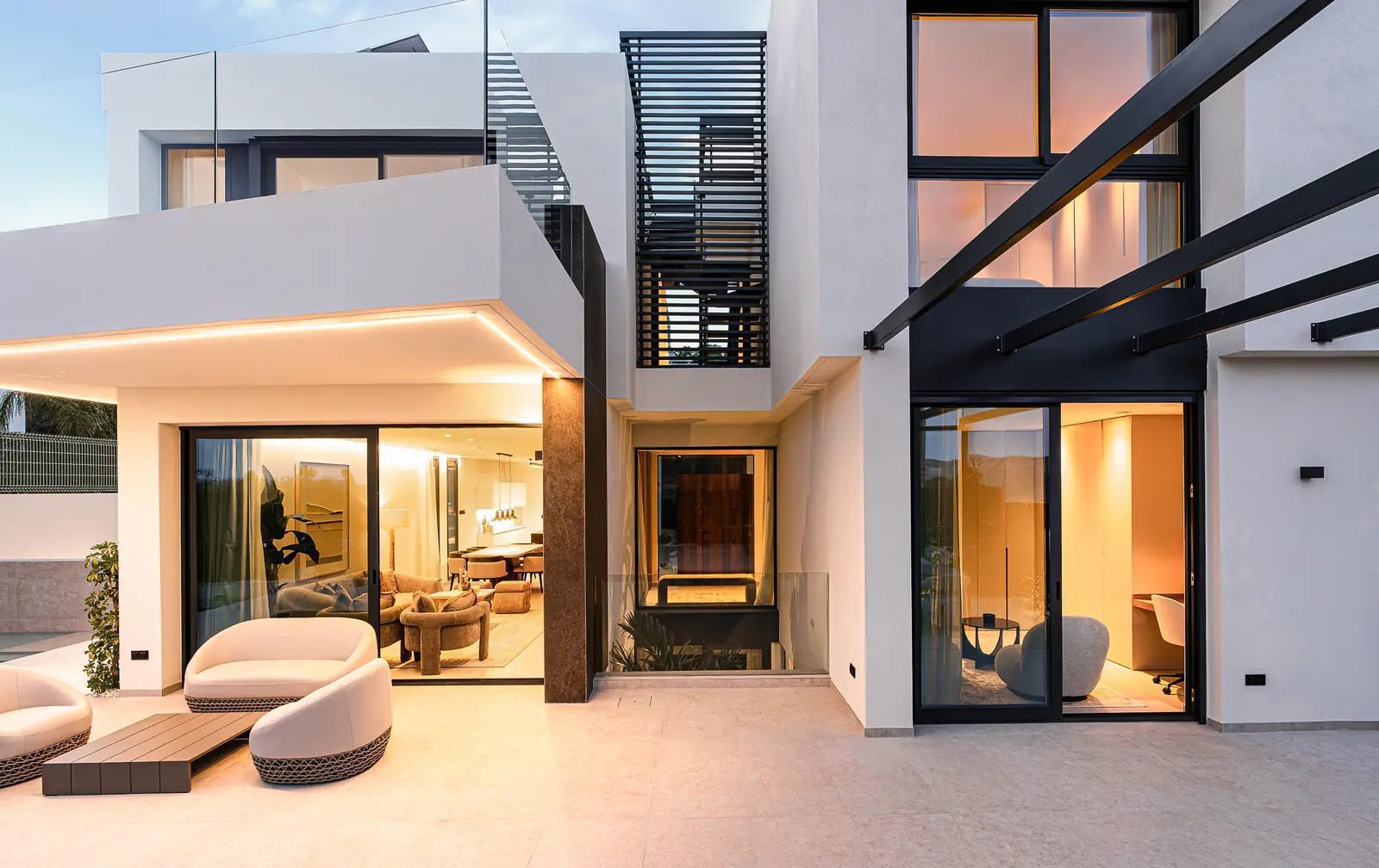 Modern exterior architecture and illuminated interior of a 4-bedroom villa in La Nucia - The Estates