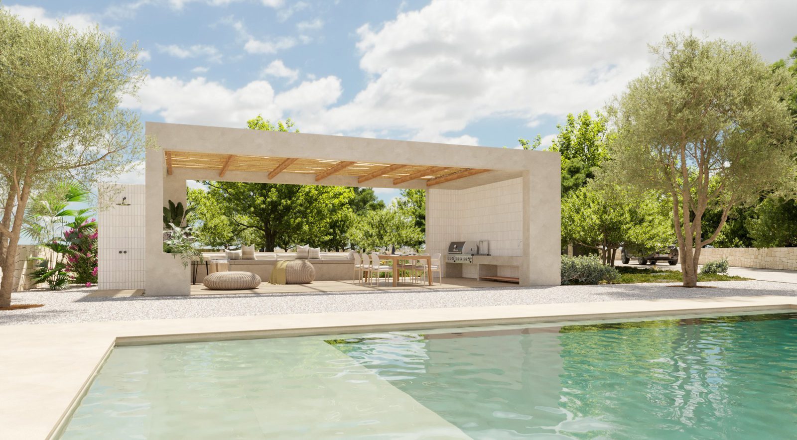 Pool and covered outdoor lounge with kitchen surrounded by gardens and countryside views at a 4-bedroom villa in Moraira - The Estates