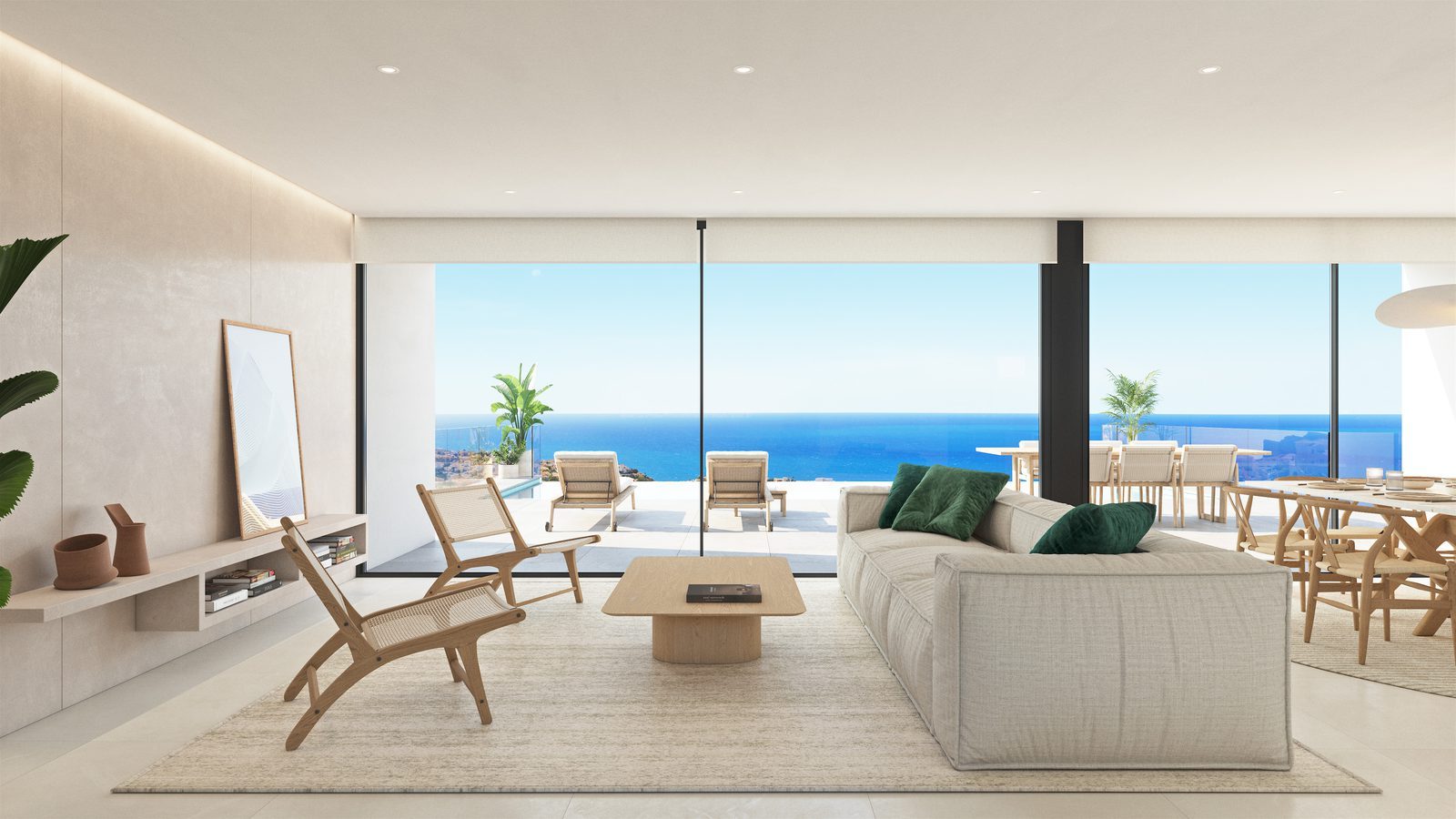 Bright open-plan living and dining room with panoramic sea views of a 3-bedroom villa in Benitachell - The Estates