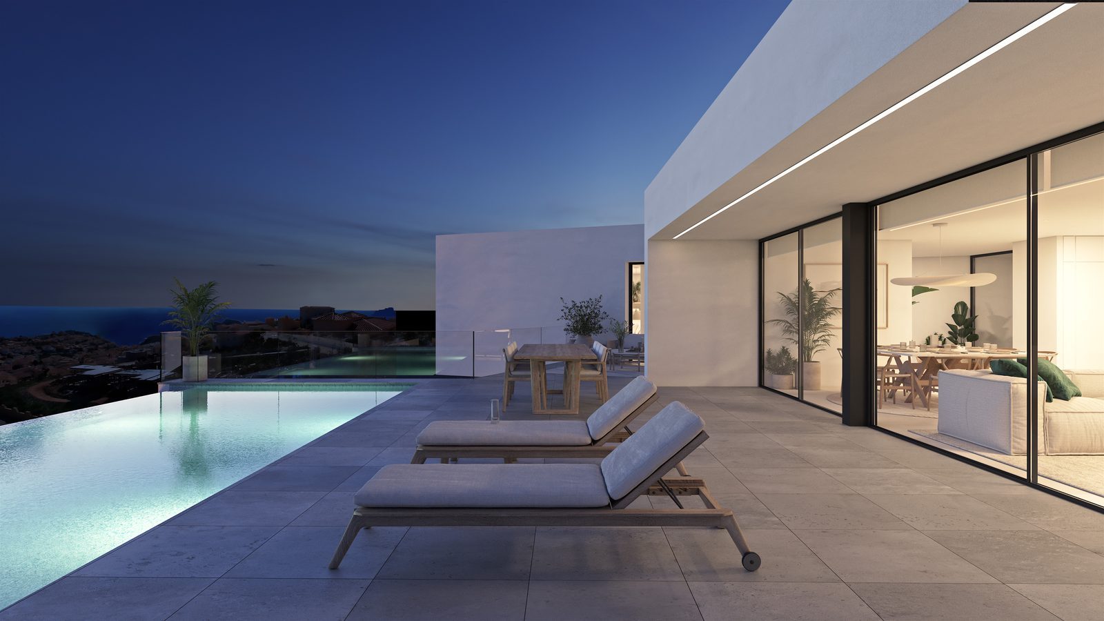 Infinity pool terrace with loungers and panoramic sea views of a 3-bedroom villa in Benitachell - The Estates