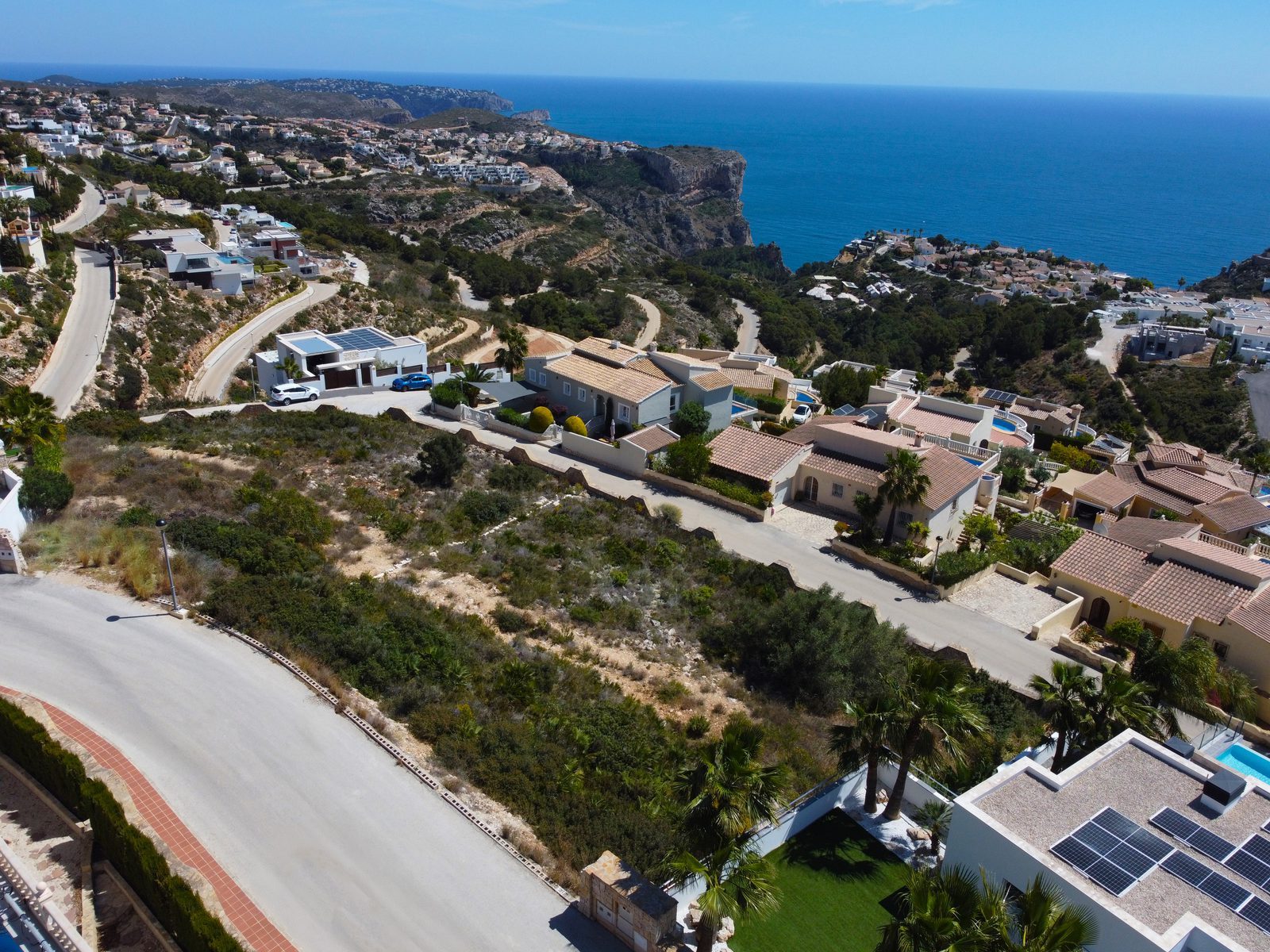 Aerial panoramic sea view over Cumbre del Sol, cliffs and surrounding