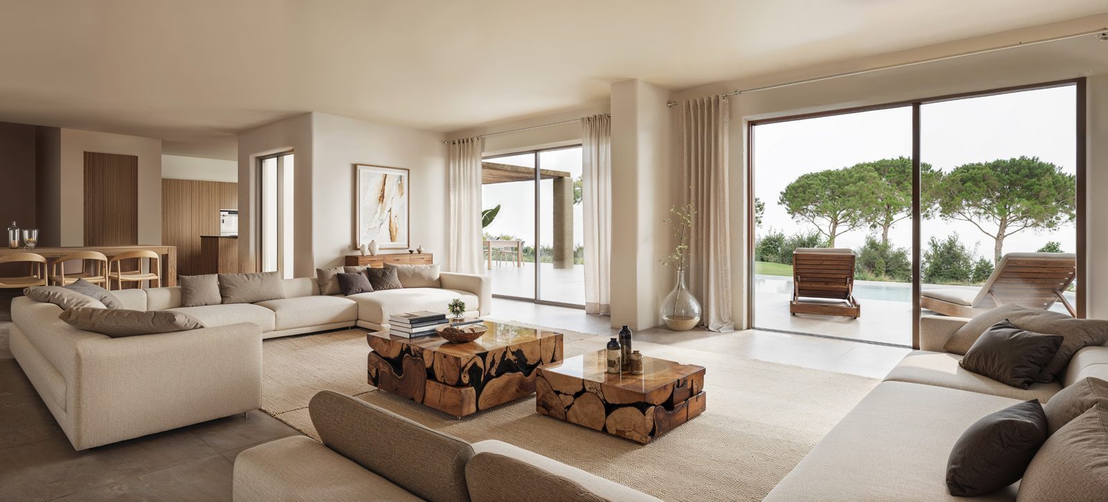 Spacious open-plan living and dining room with garden and pool views in a 4-bedroom villa in Jávea - The Estates