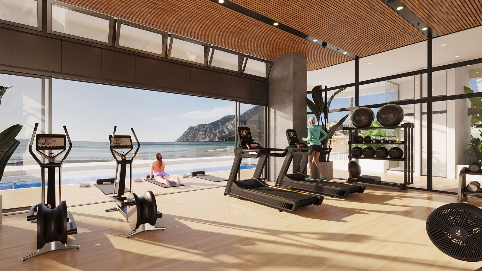 A modern gym with stunning sea views inside a 3-bedroom duplex in Calpe - The Estates