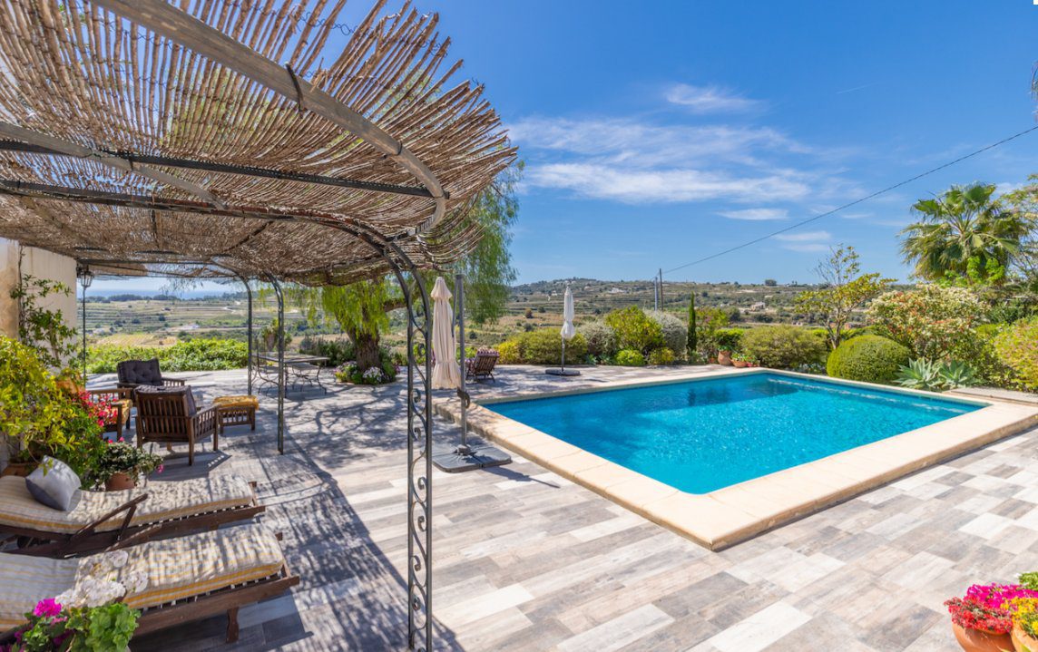 A beautiful outdoor terrace and pool area of an 8-bedroom finca in Moraira - The Estates