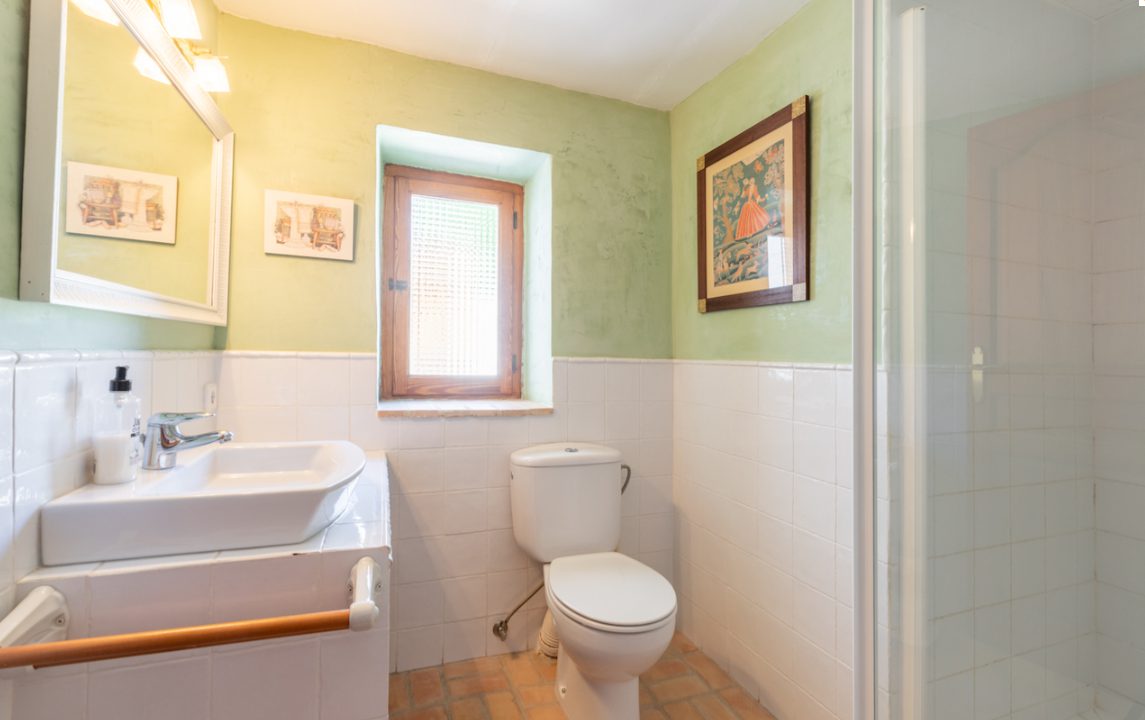 A well-appointed bathroom with a window and shower in an 8-bedroom finca in Moraira - The Estates