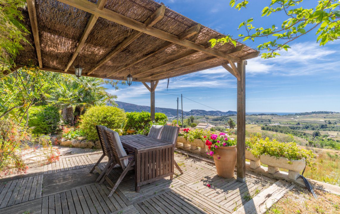 Outdoor dining area with stunning sea and countryside views of an 8-bedroom finca in Moraira - The Estates