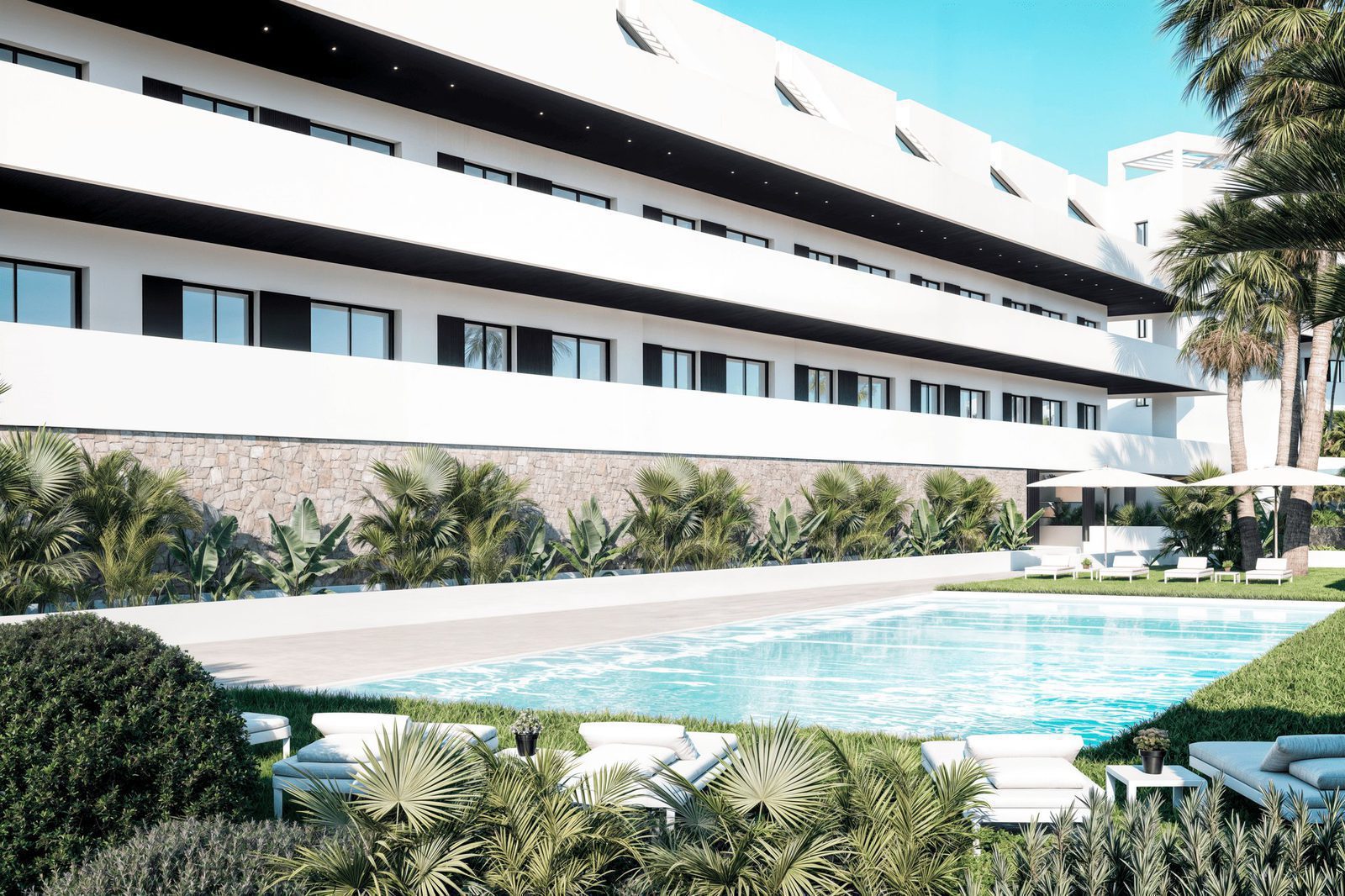 A swimming pool and landscaped gardens surrounding a modern building - The Estates