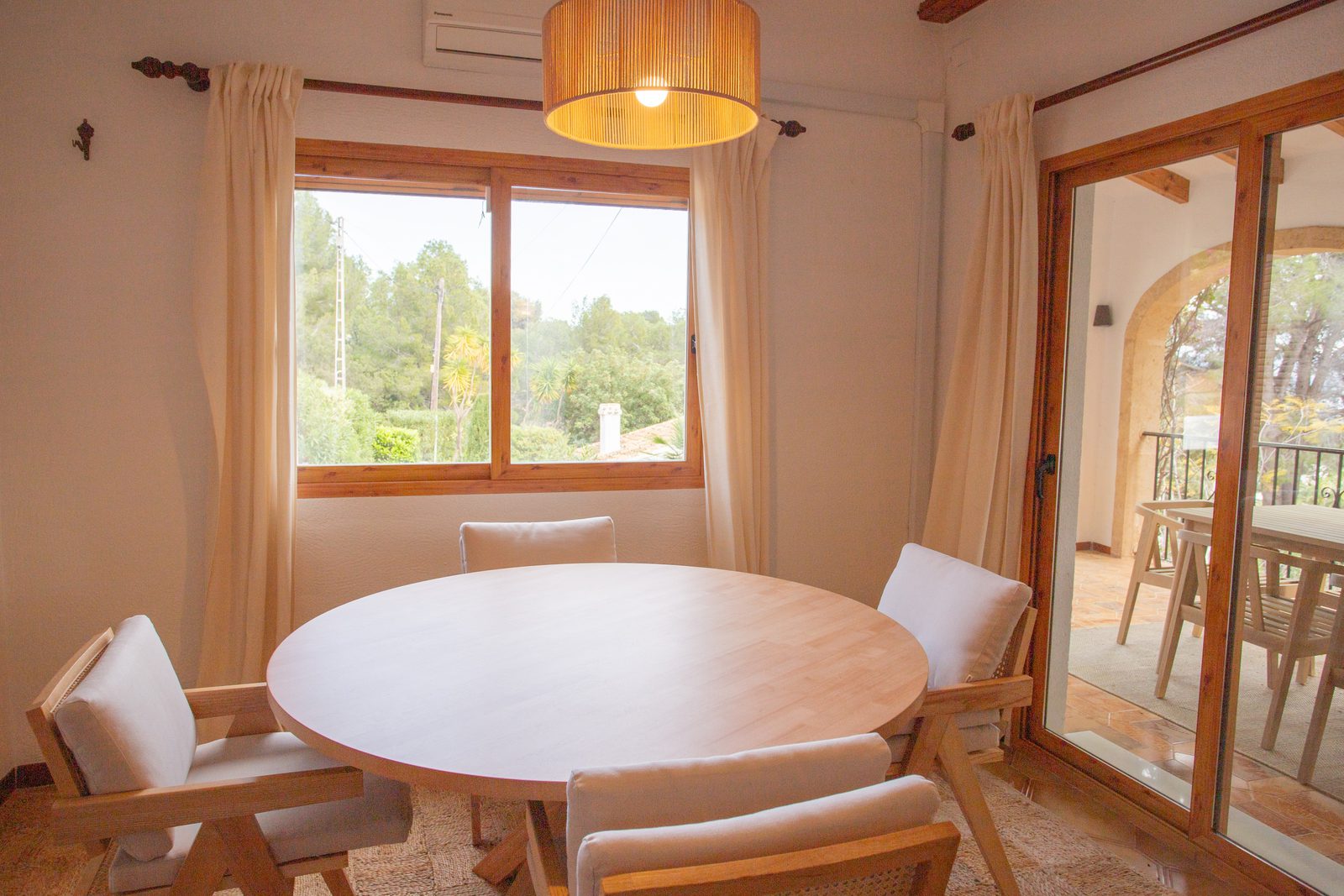 Bright dining area with patio access in a 2-bedroom villa in Javea / Xabia - The Estates