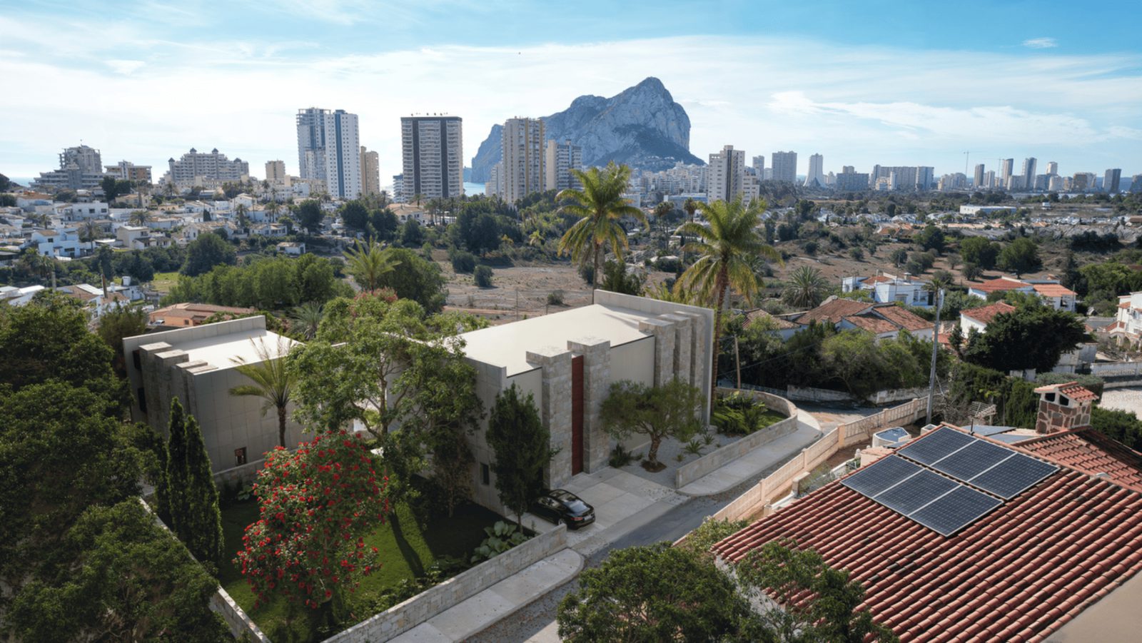 Mountain and city views from a 3-bedroom villa in Calpe, with lush gardens and solar panels - The Estates