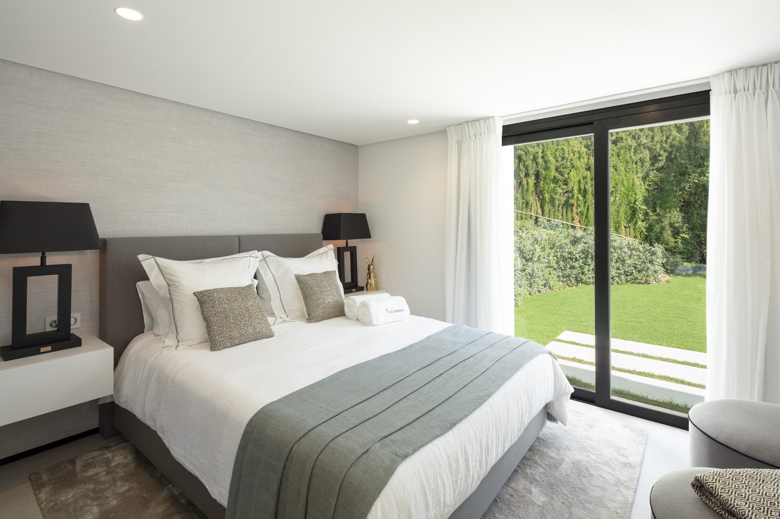 Contemporary bedroom with garden views in a 5-bedroom villa in Málaga - The Estates