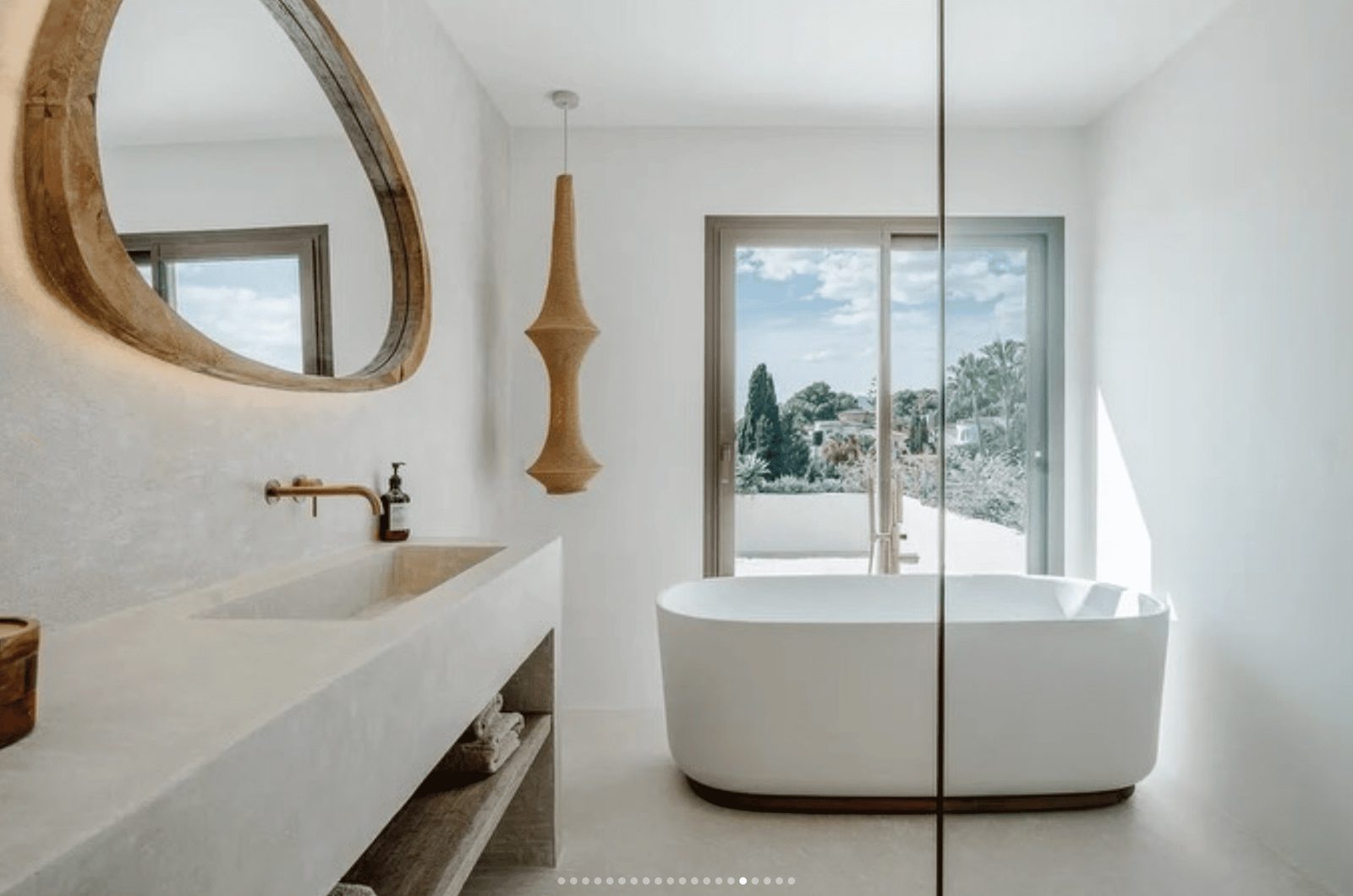 Stylish bathroom with a freestanding tub and garden views of a 5-bedroom villa in Benissa - The Estates