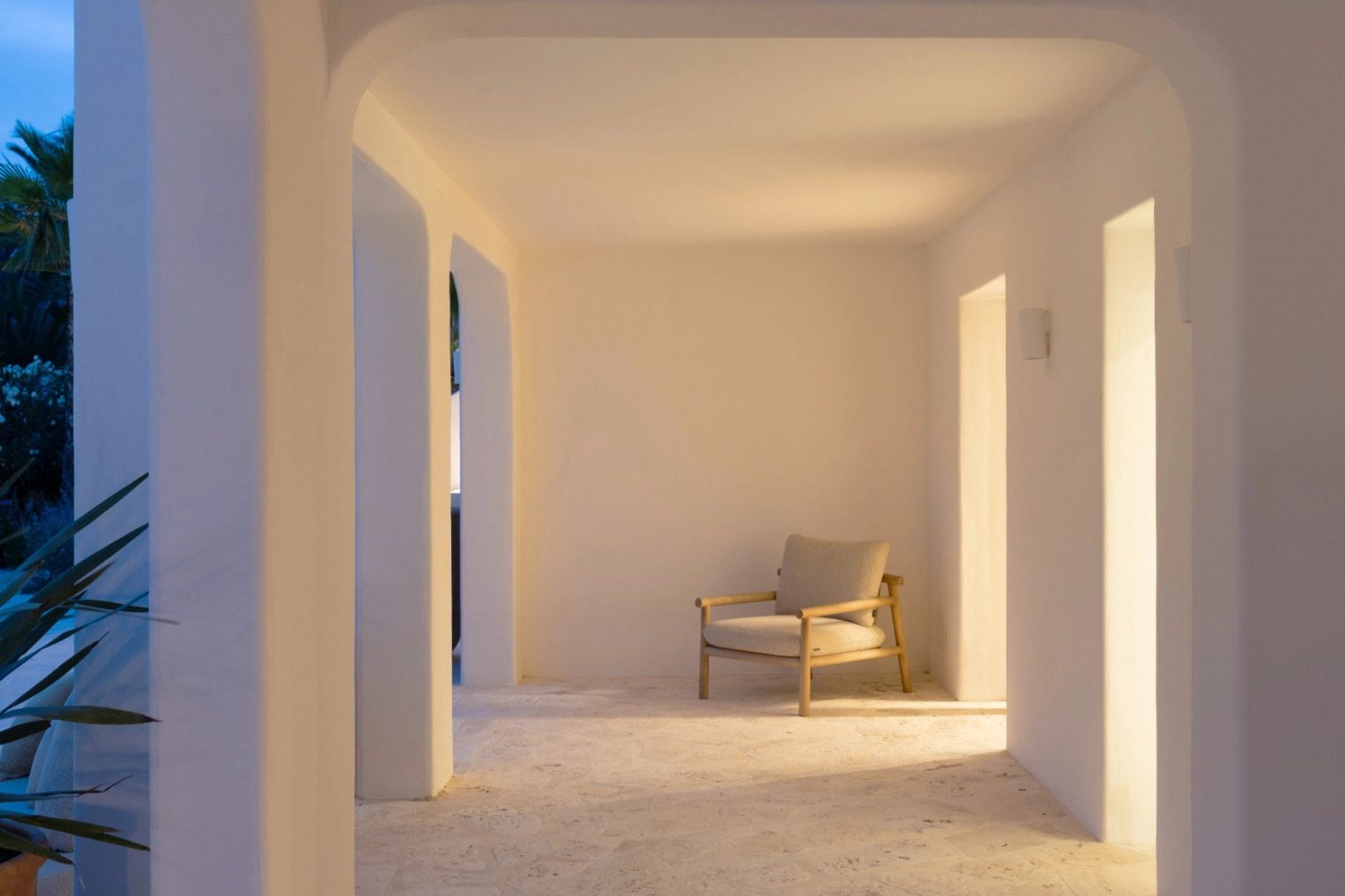 An interior hallway with an armchair in a 5-bedroom villa in Benissa - The Estates