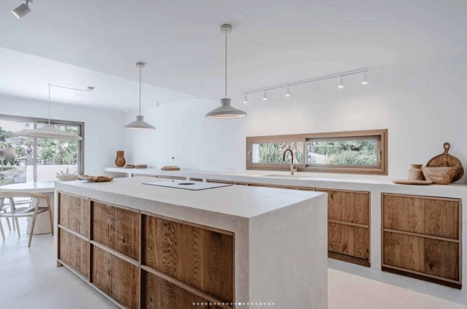 Stylish kitchen island and wooden cabinetry in a 5-bedroom villa in Benissa - The Estates