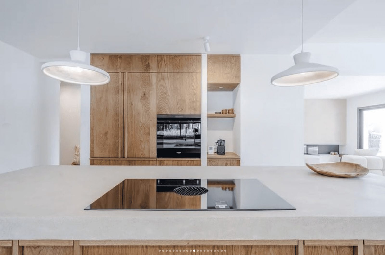 Modern kitchen with wooden cabinets and sleek appliances in a 5-bedroom villa in Benissa - The Estates