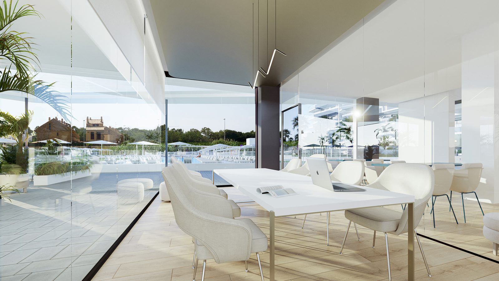 A bright living area with a desk and pool views in a 3-bedroom apartment in Canet den Berenguer - The Estates