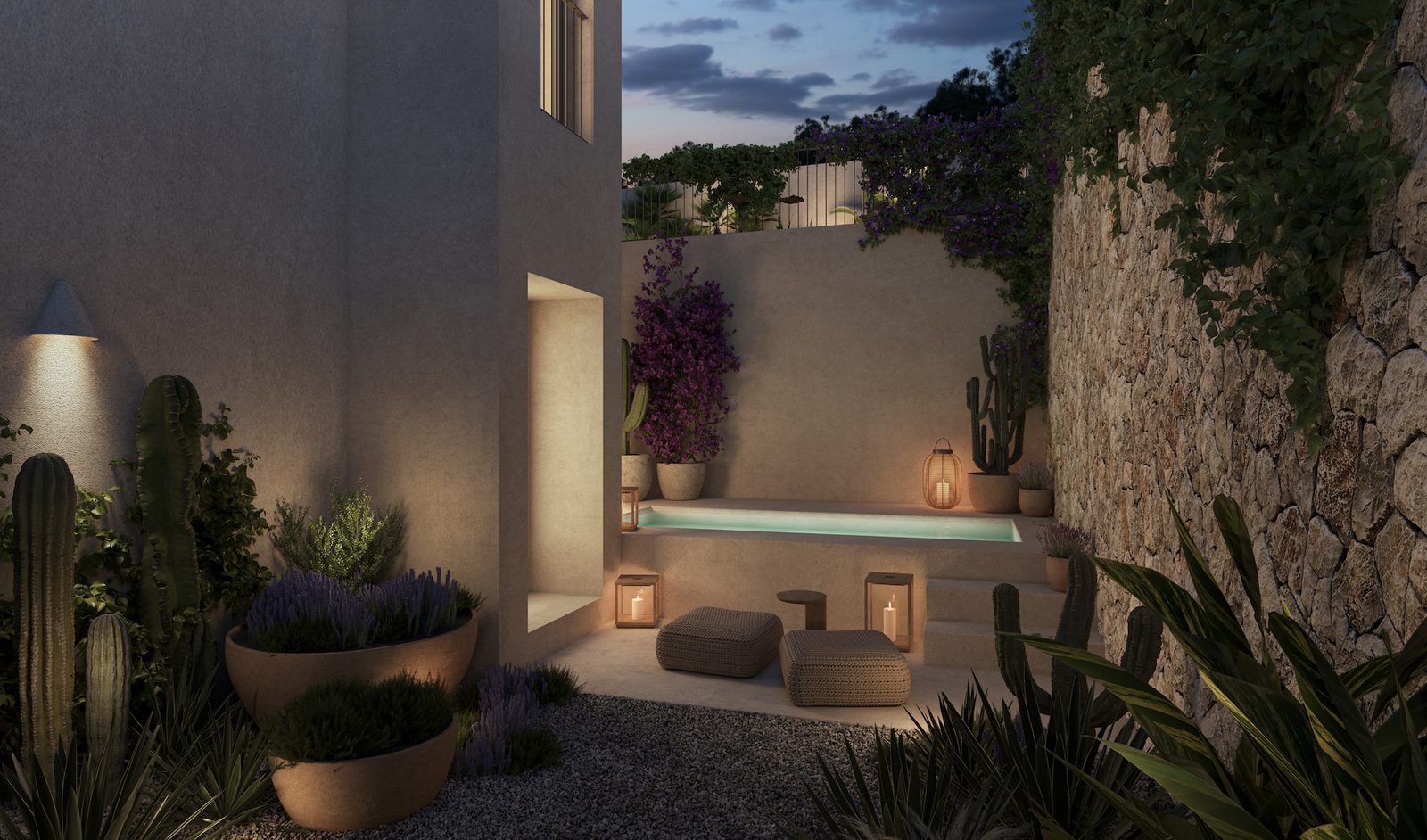 Dusk courtyard with a plunge pool, cacti and stone wall of a