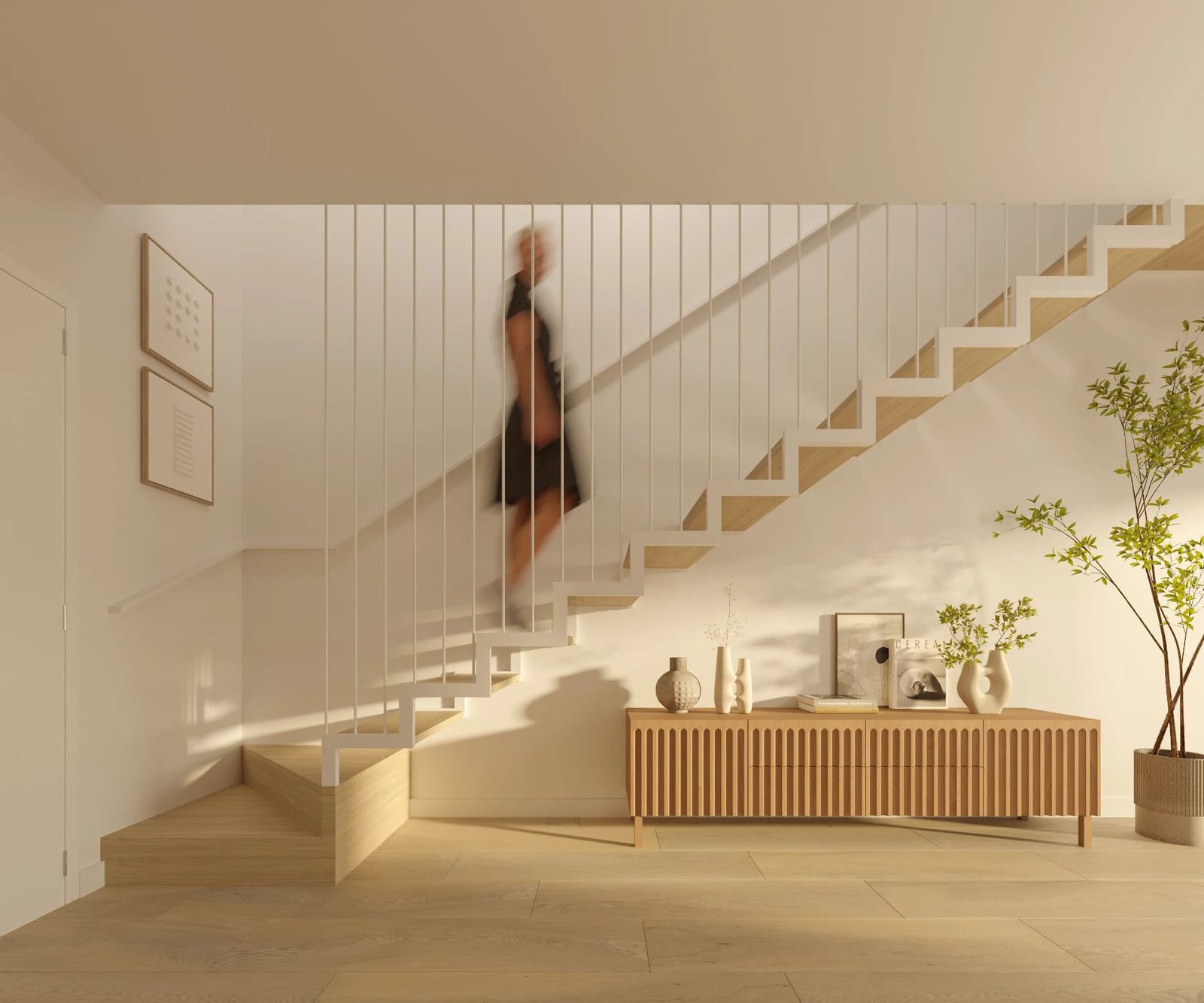 A modern staircase with a person ascending, inside a 3-bedroom townhouse in El Verger - The Estates