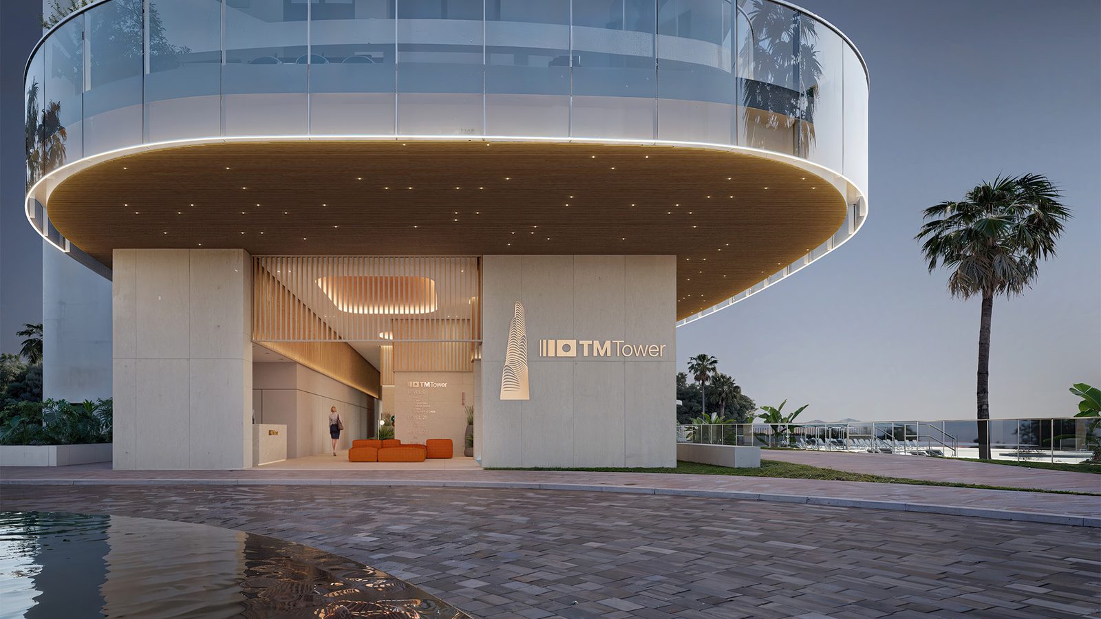 Modern apartment building exterior with pool and palm trees - The Estates