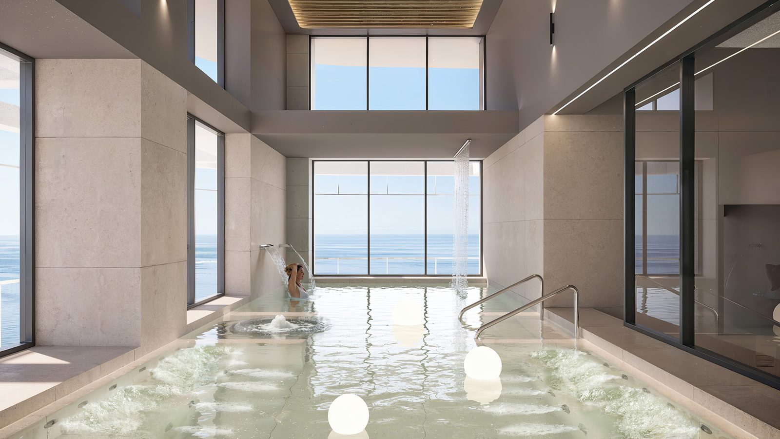 A luxurious indoor pool with sea views inside a 4-bedroom apartment in Benidorm - The Estates