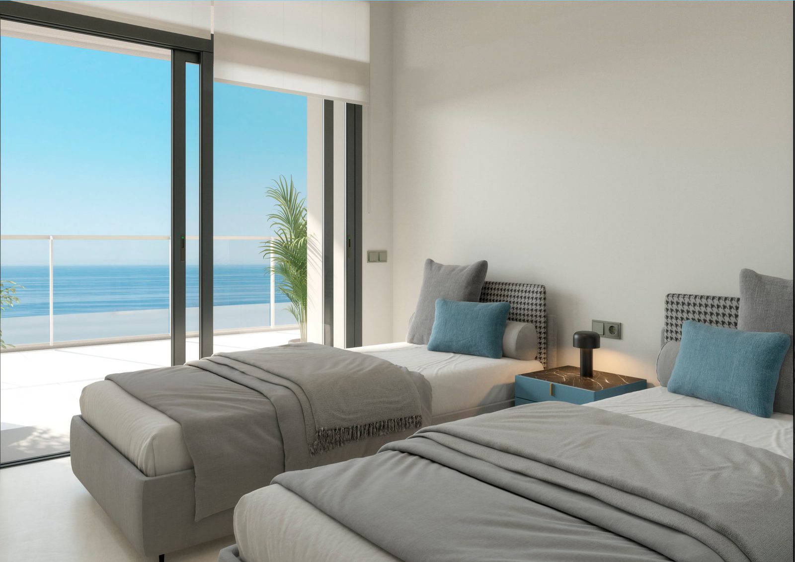 A bright bedroom with twin beds and a stunning sea view in a 4-bedroom apartment in Benidorm - The Estates