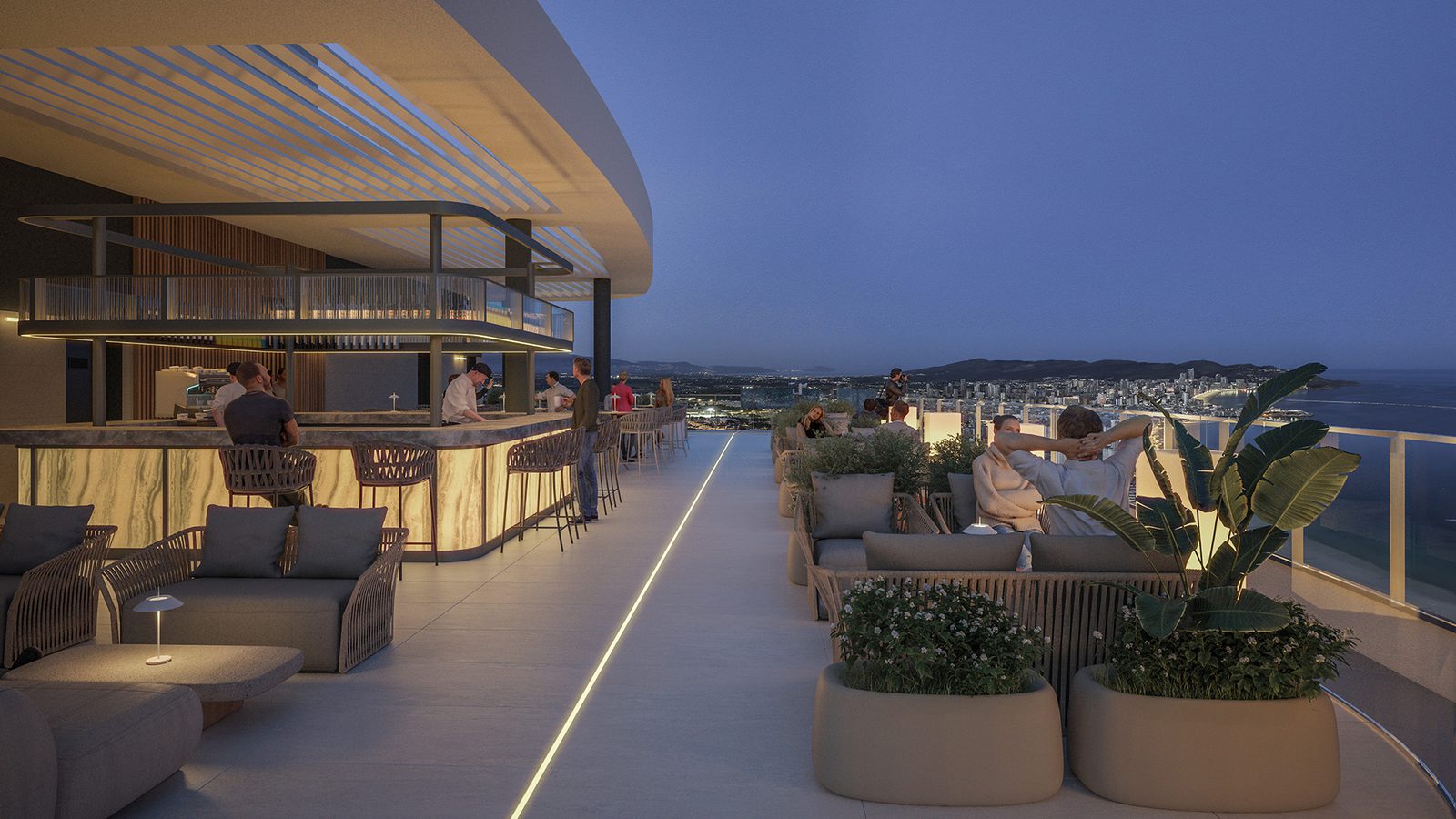 Rooftop terrace with seating and bar area overlooking the sea from a 4-bedroom apartment in Benidorm - The Estates