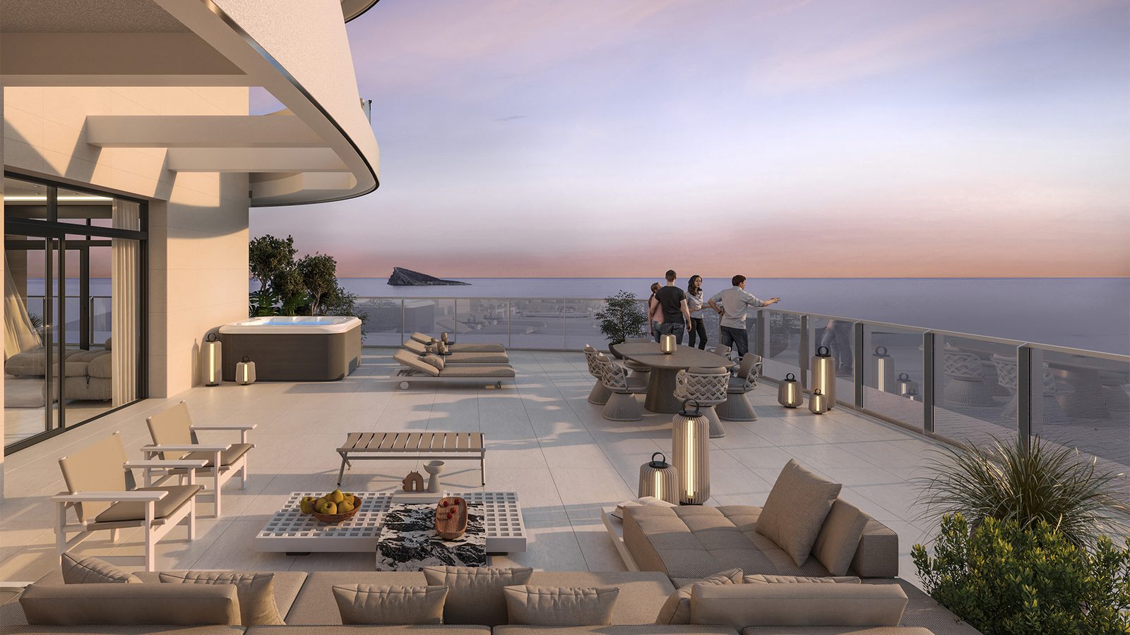 A spacious terrace with seating and a jacuzzi overlooking the sea from a 4-bedroom apartment in Benidorm - The Estates